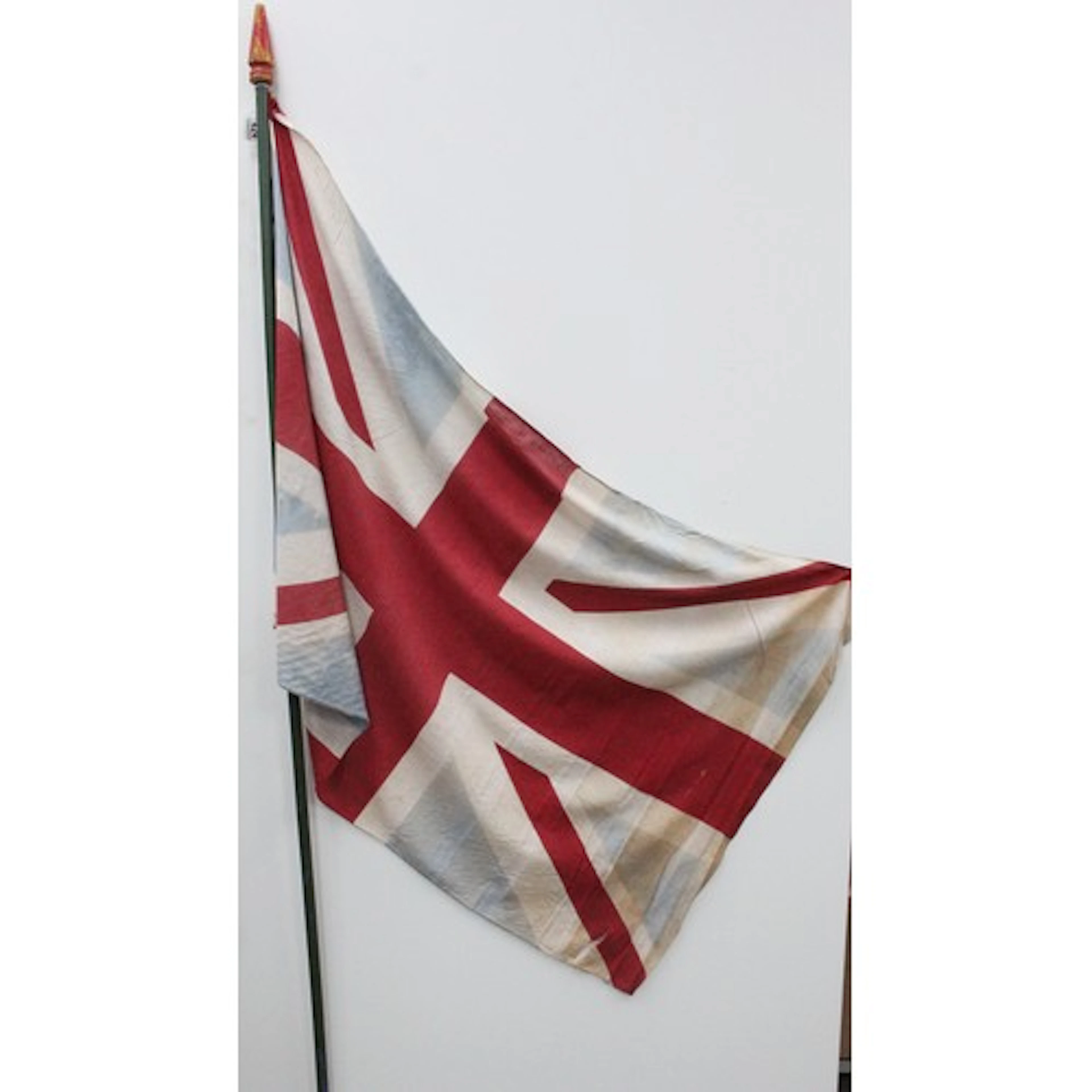 Vintage fabric Union Jack flag, 126cm x 77cm, on a painted w...