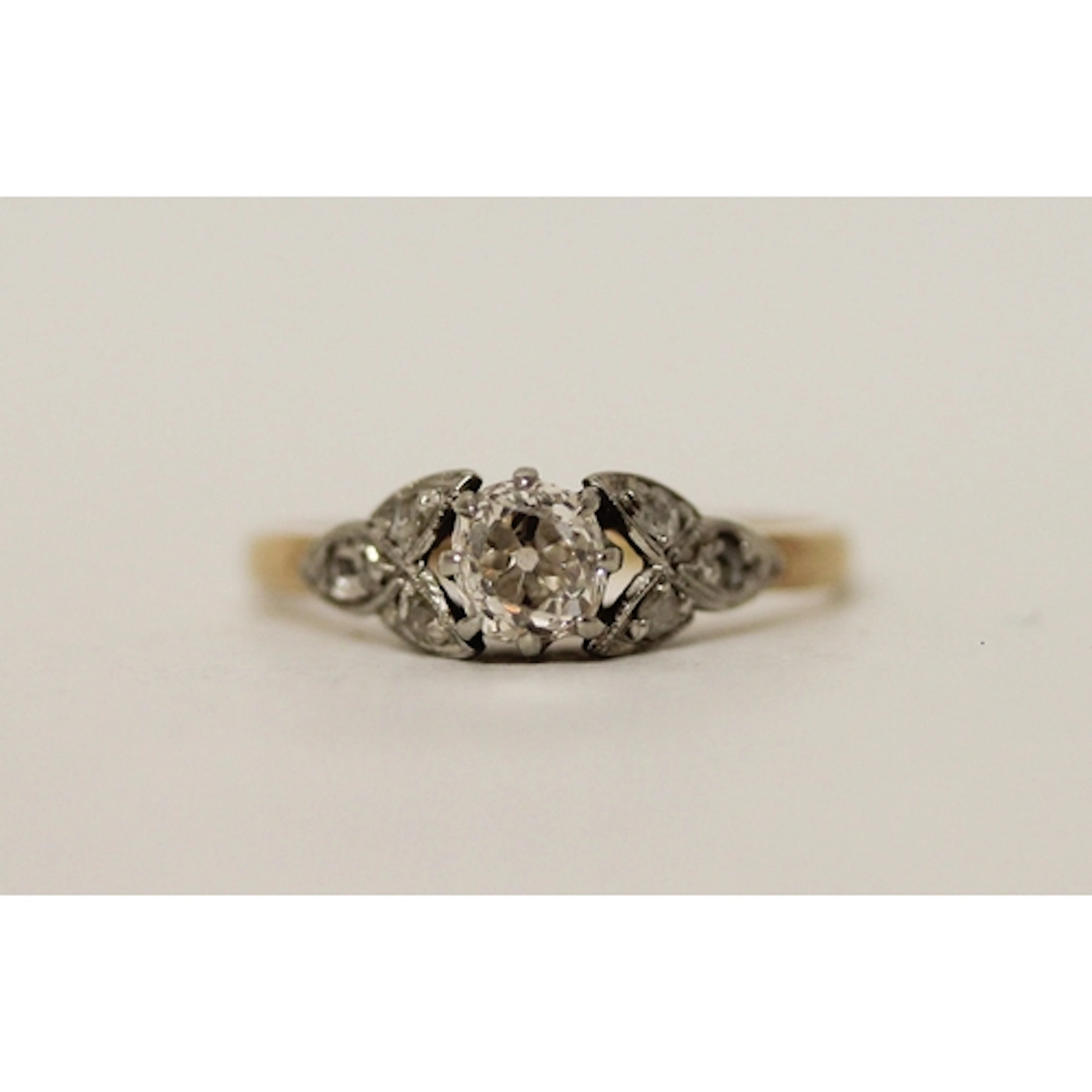 A 1920's diamond engagement ring on an 18ct gold and platinu...