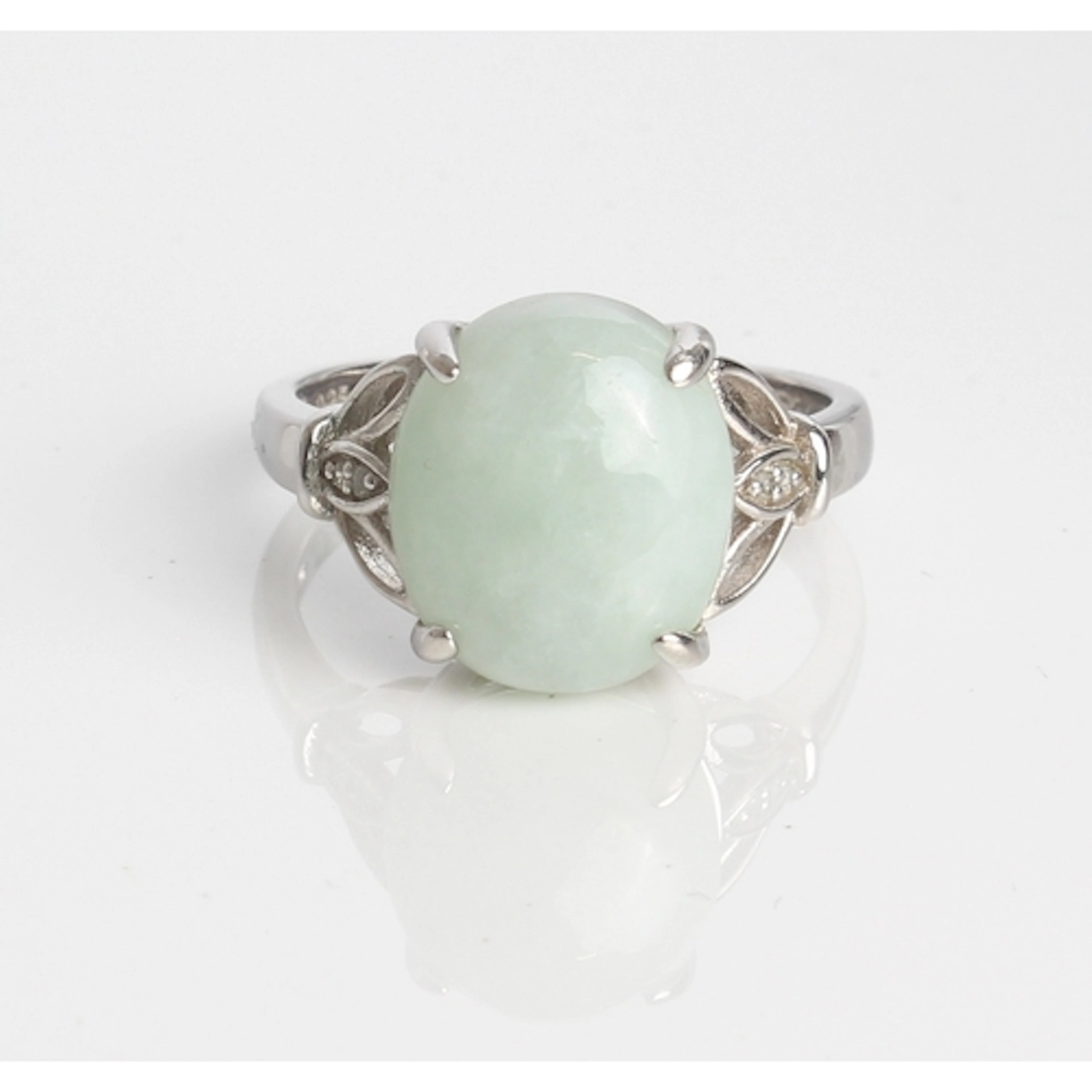 A jade and diamond sterling silver ring - the 8.62ct oval ca...