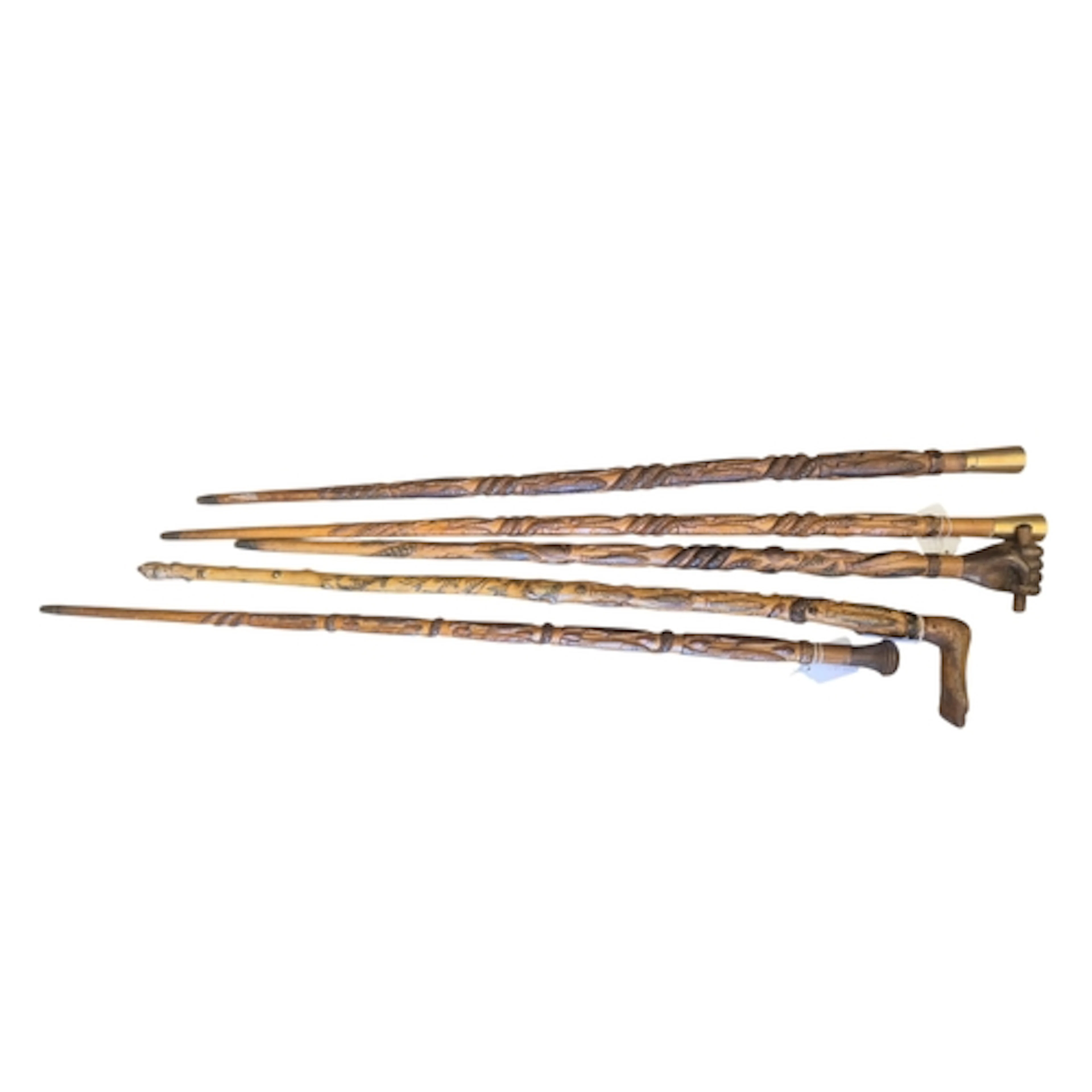 Welsh Folk Art - a group of five carved wood walking sticks,...