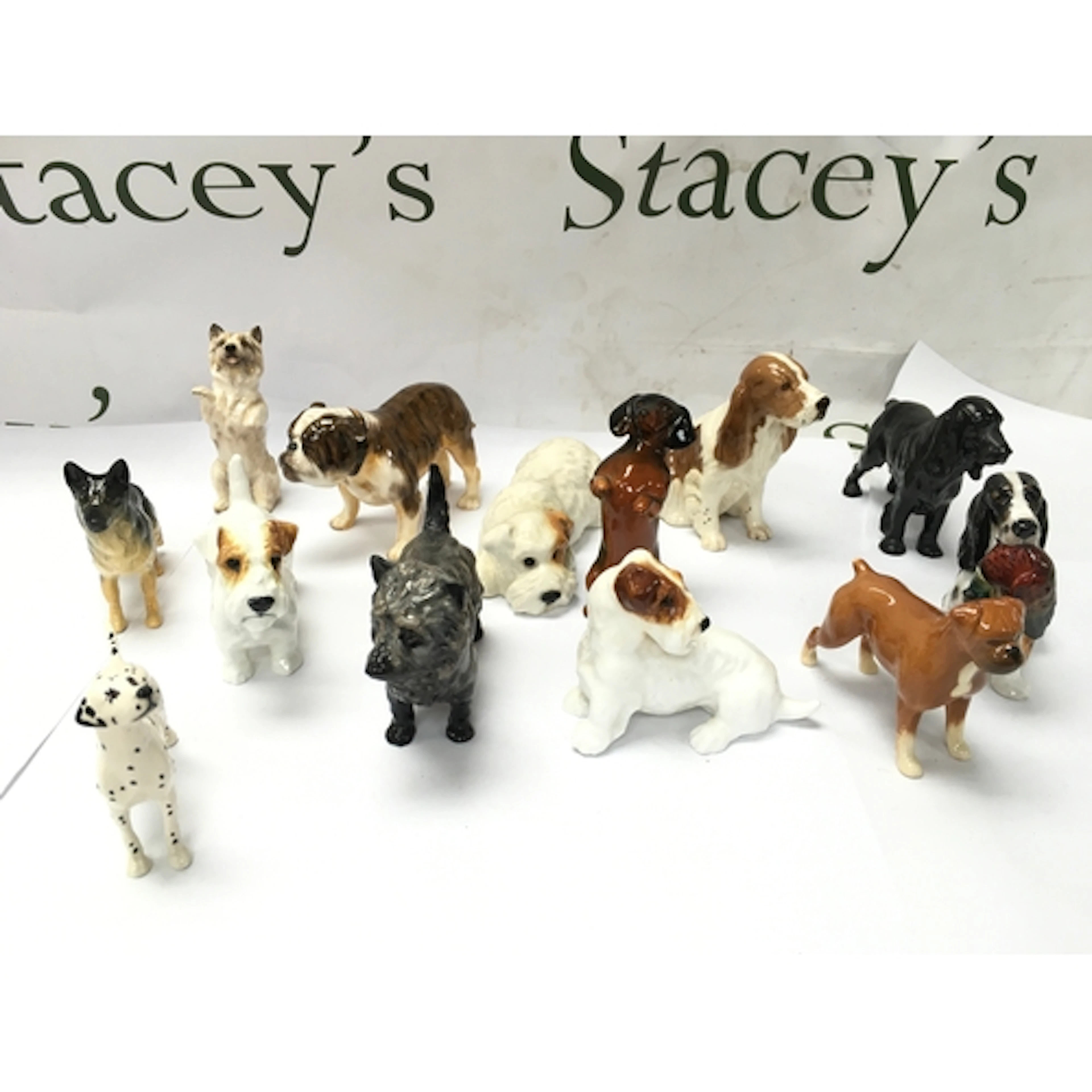 vintage ceramic and porcelain dog figurines, including maker...