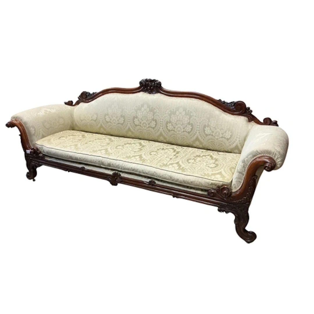 An early Victorian rosewood scroll arm settee, length 245cm,...