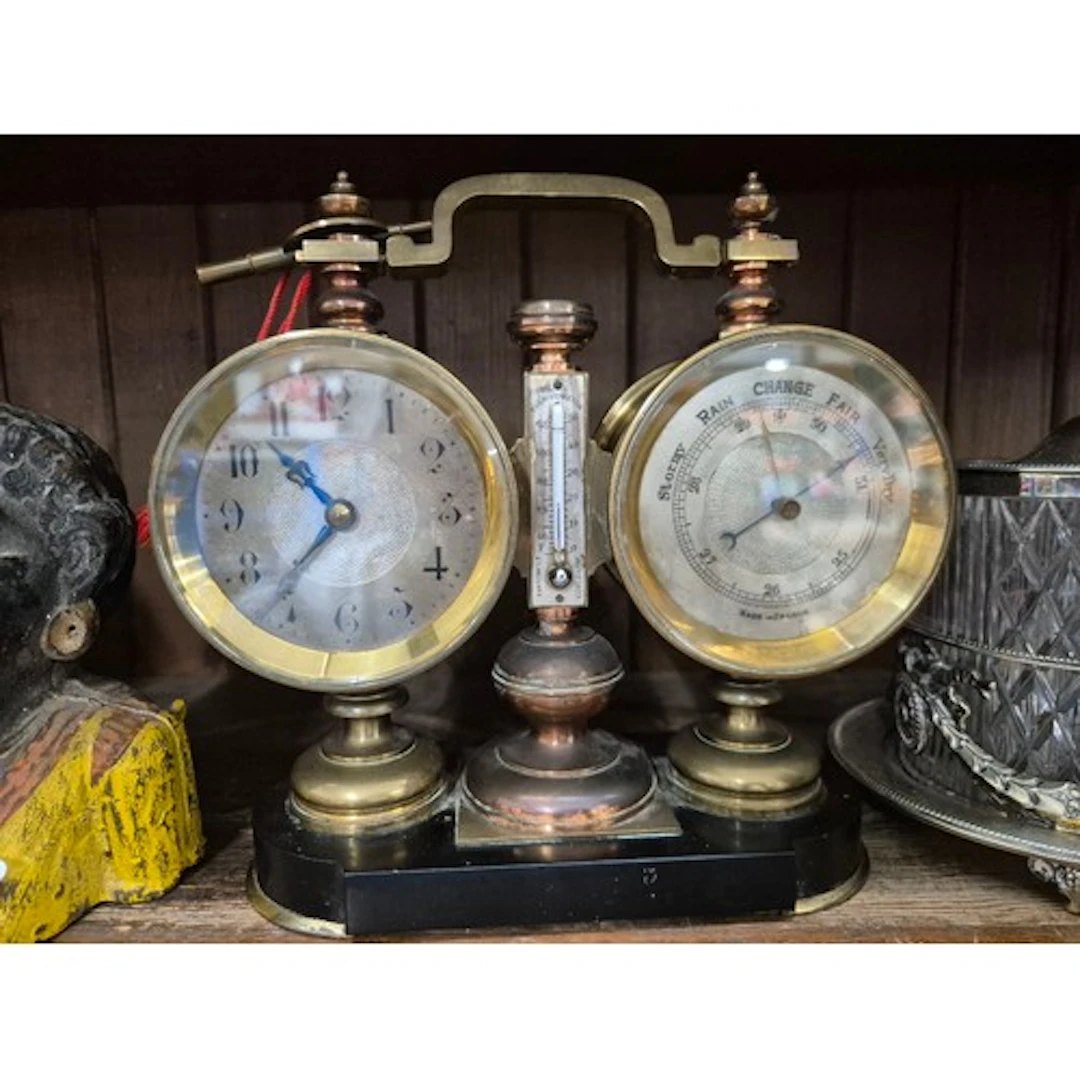 An antique French desk or mantle weather station featuring a...