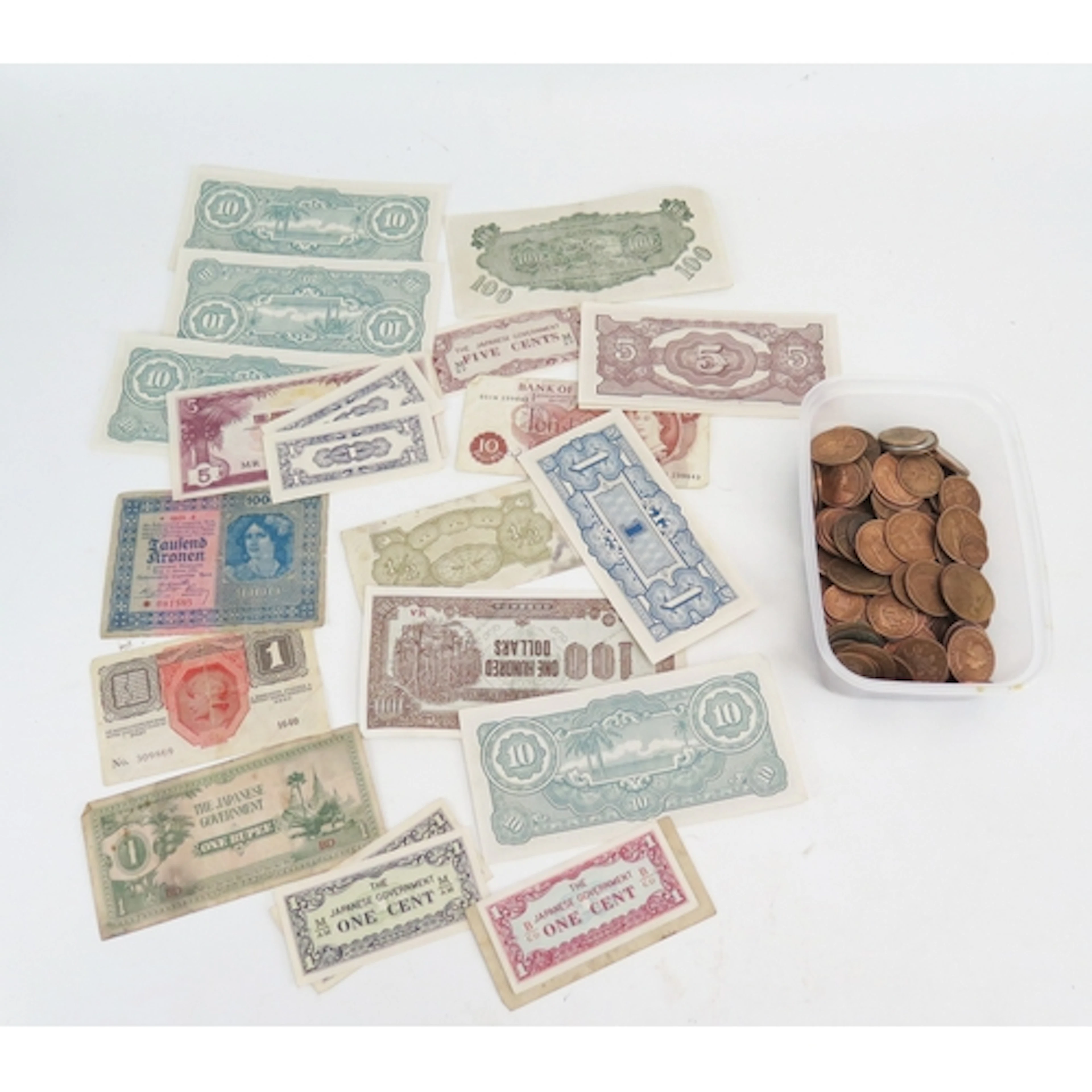A selection of world bank notes and coins