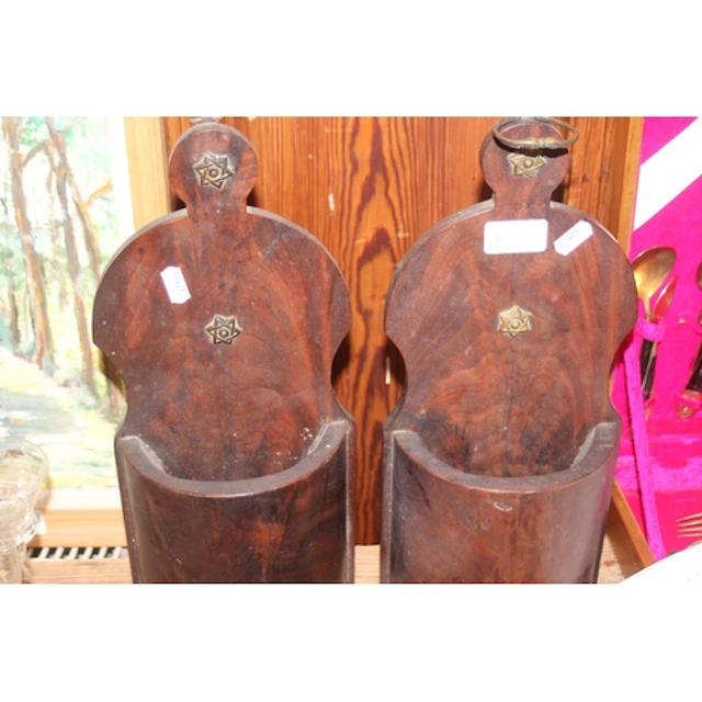 Antique wooden wall mounted pockets.