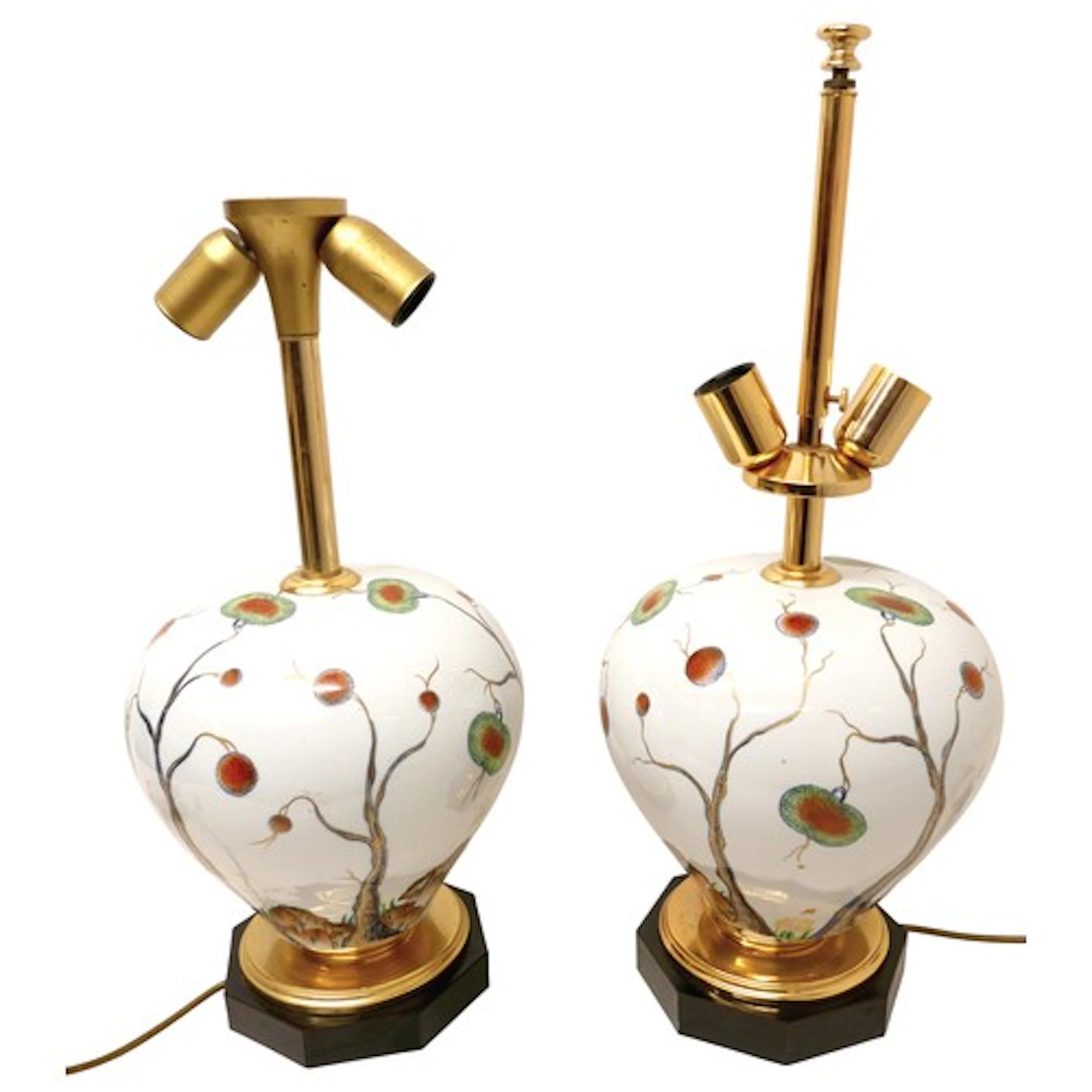 Two surreal decorated china table lamps 65 and 56cm high.(2)