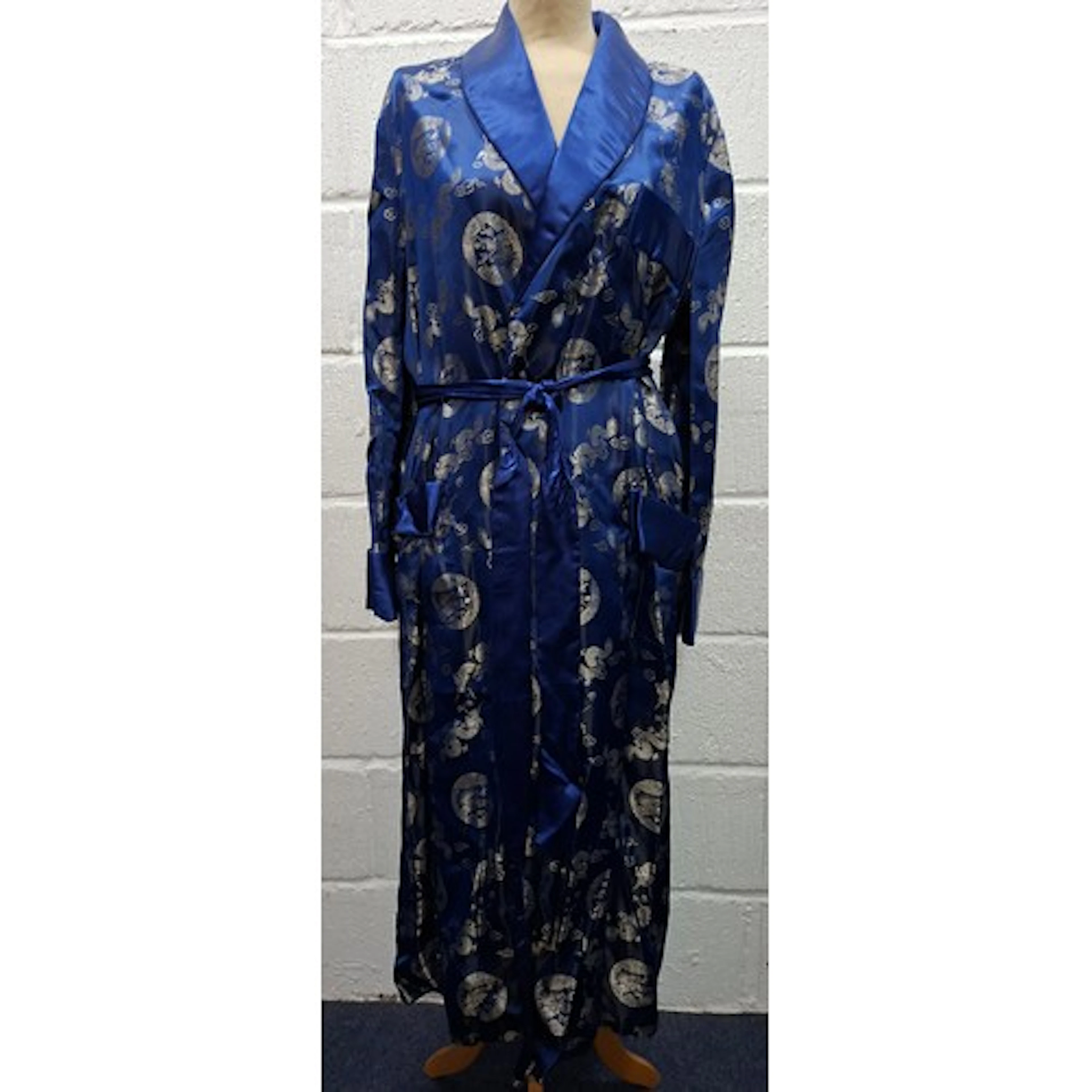 An unworn Chinese navy machine embroidered gown having silve...