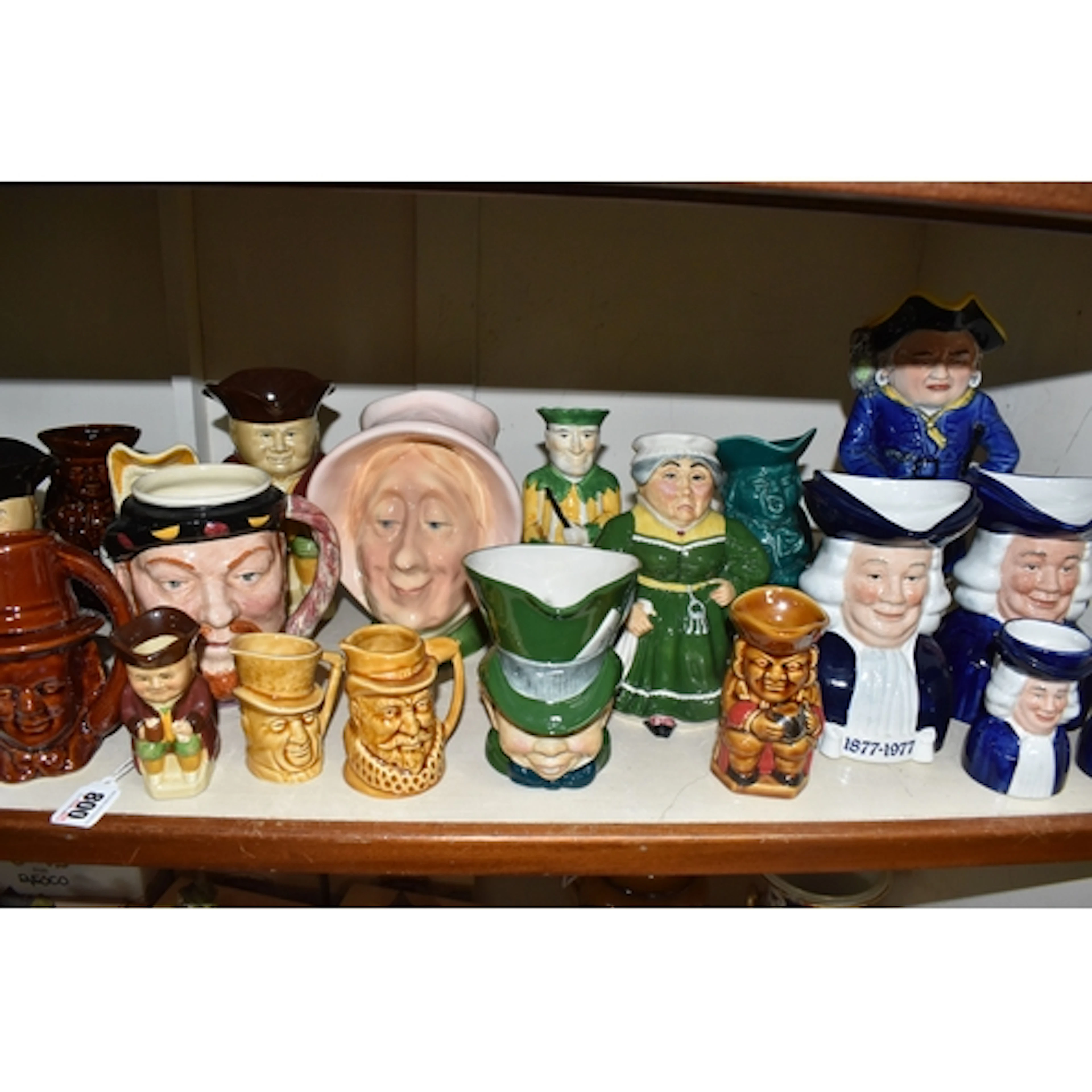 A COLLECTION OF TOBY AND CHARACTER JUGS, twenty examples by ...