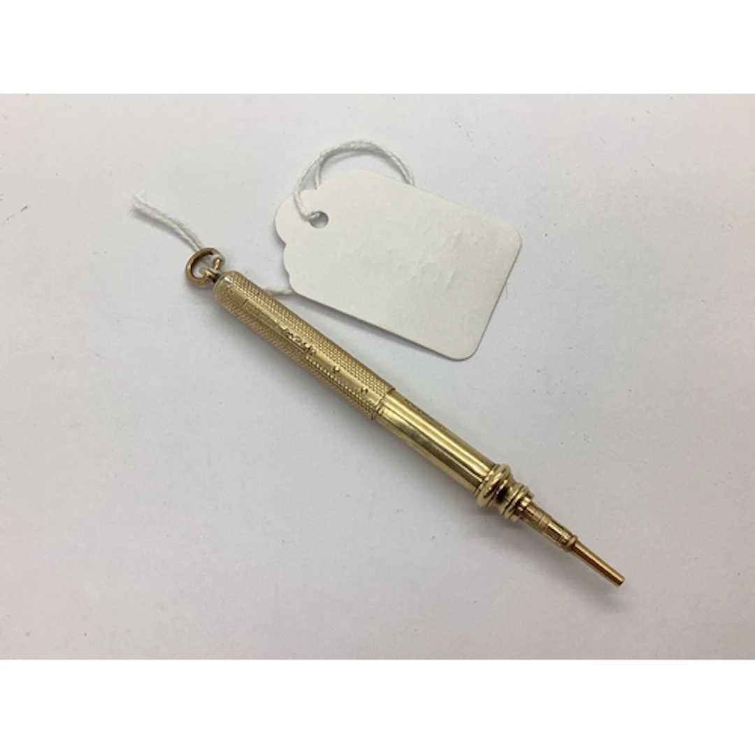 A 9ct Gold Sliding Pencil, engine turned decoration, overall...