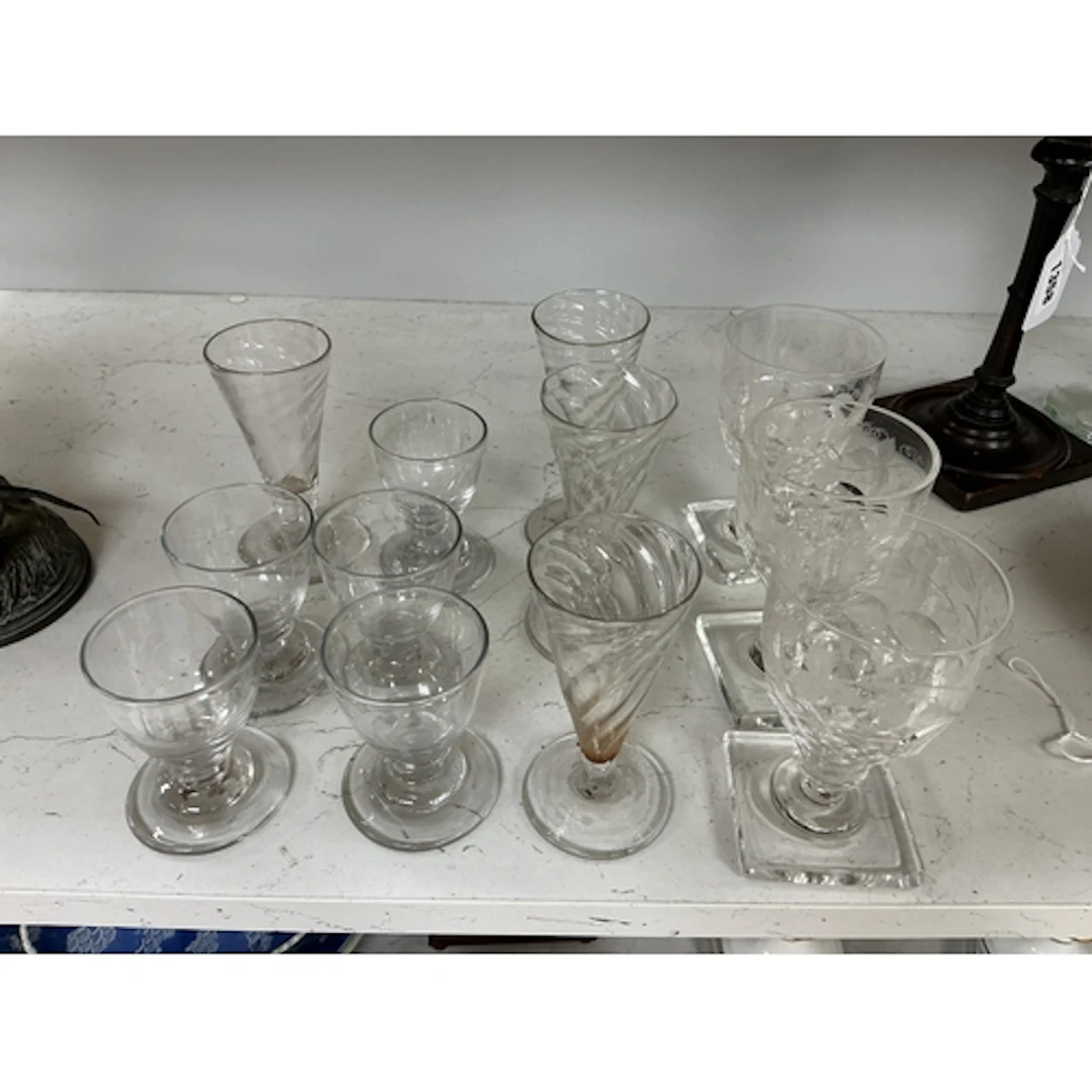 A group of twelve Georgian drinking glasses, comprising four...