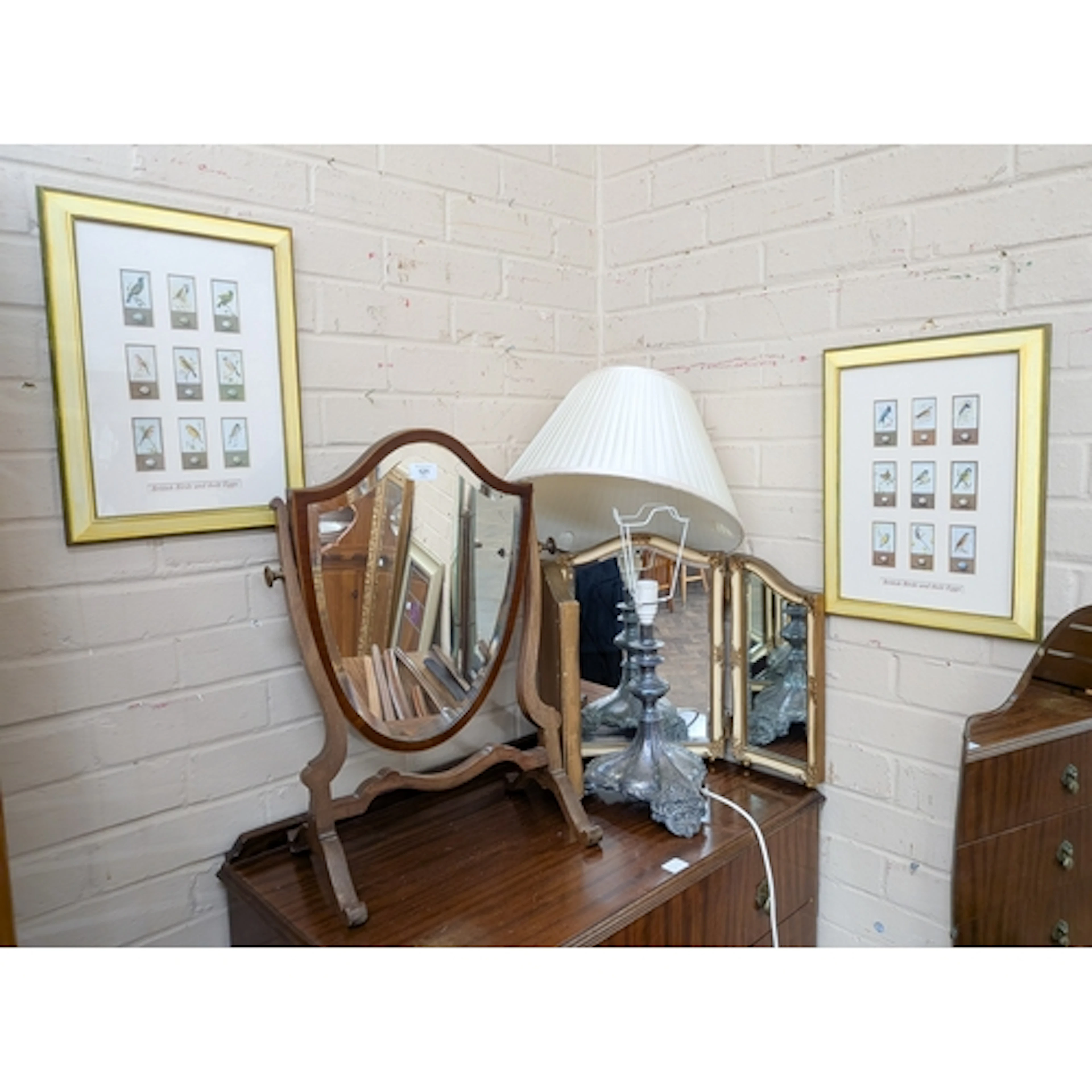 A shield shaped mahogany toilet mirror together with a small...
