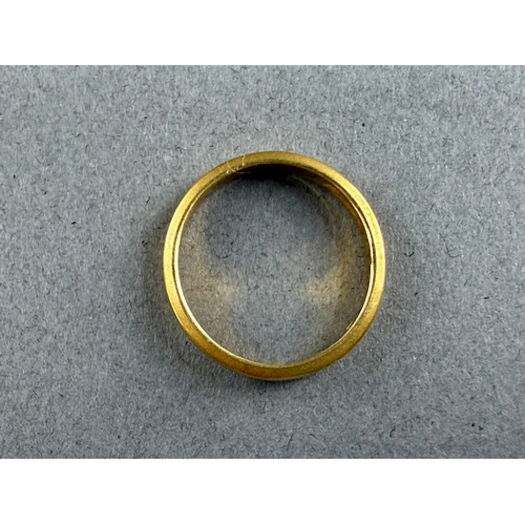 Jewellery: a 22ct yellow gold wedding band, Birmingham 1979,...