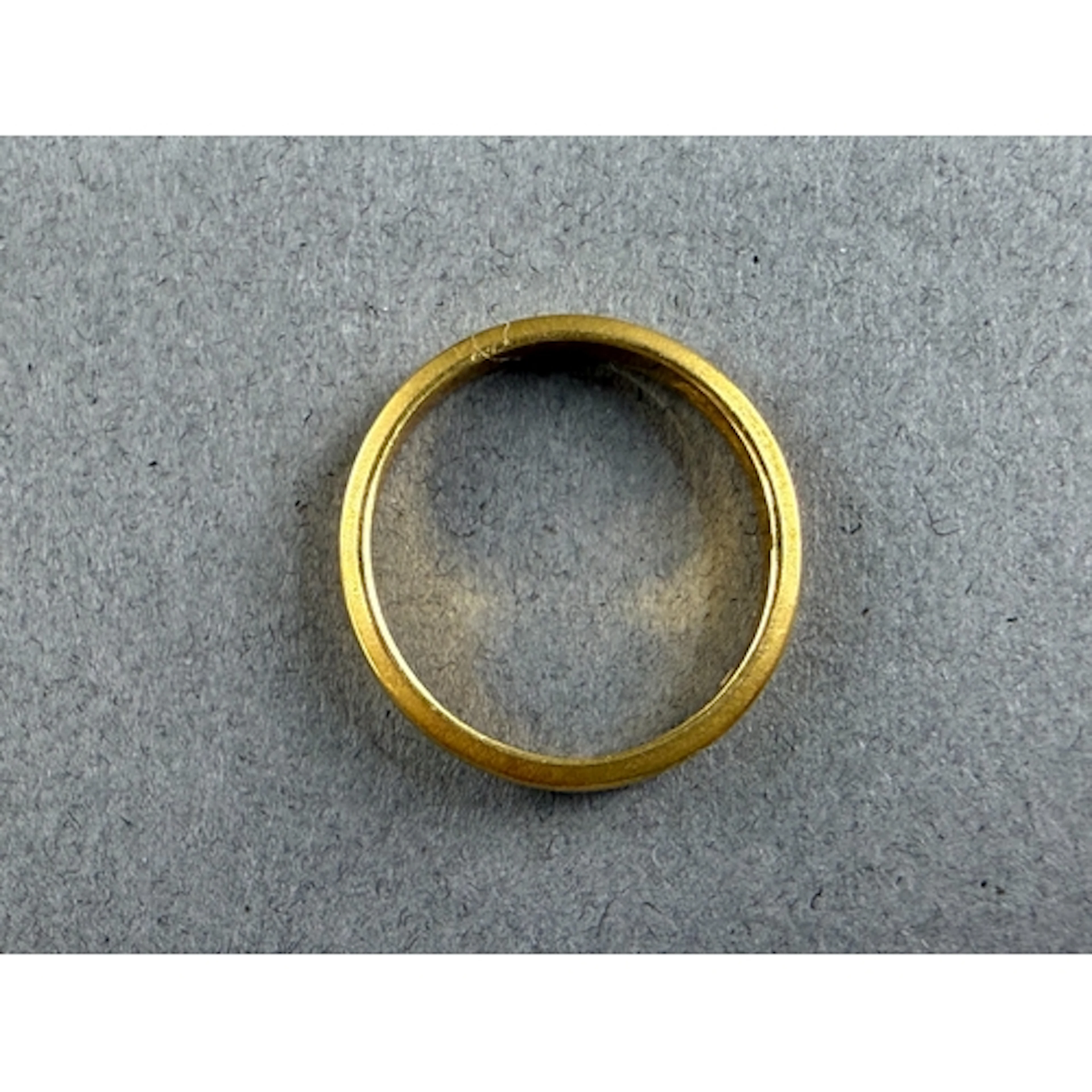 Jewellery: a 22ct yellow gold wedding band, Birmingham 1979,...