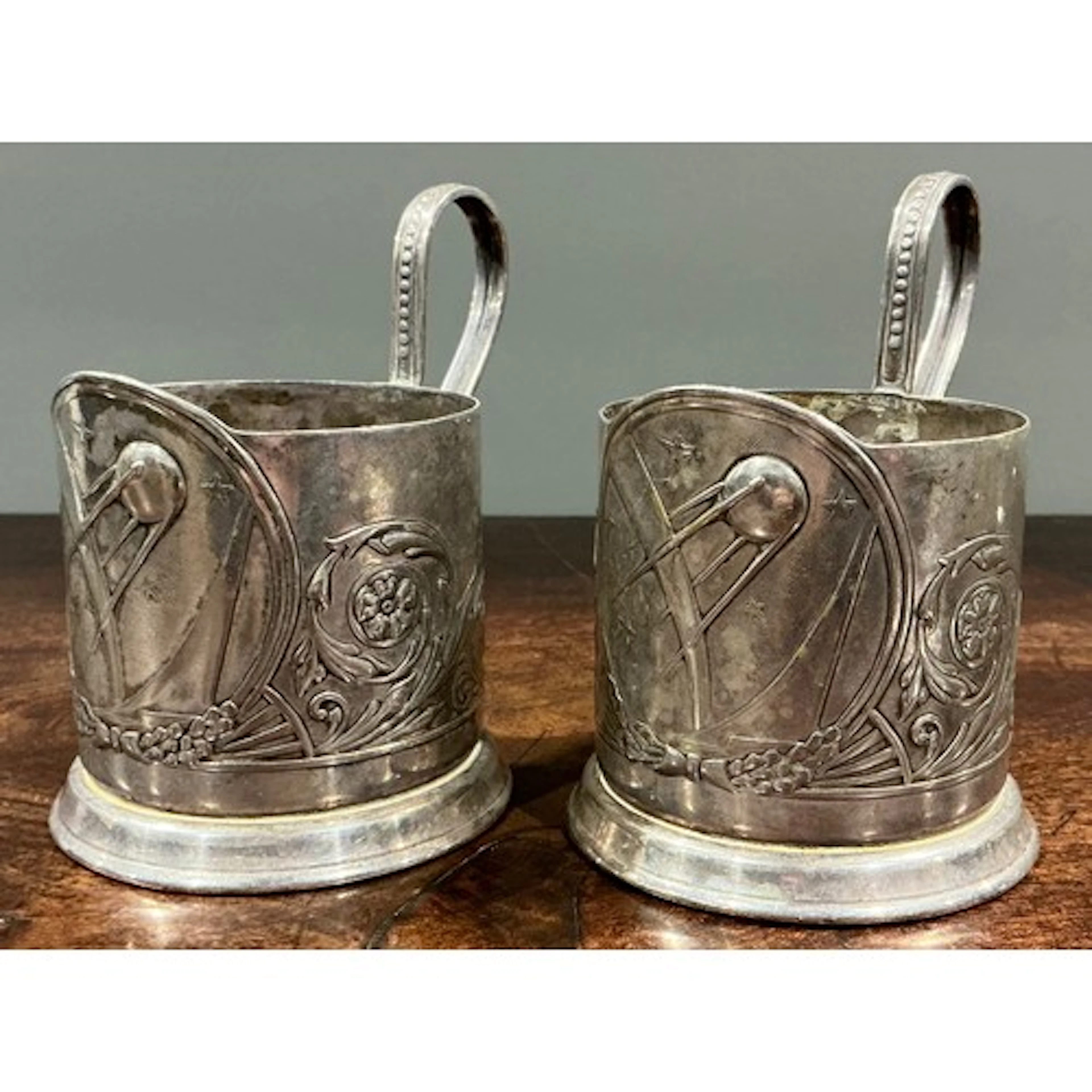 Space Race - a pair of Soviet era silver plated podstakannik...