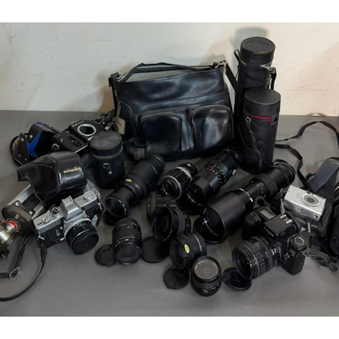 A selection of cameras and camera equipment. Various makers ...