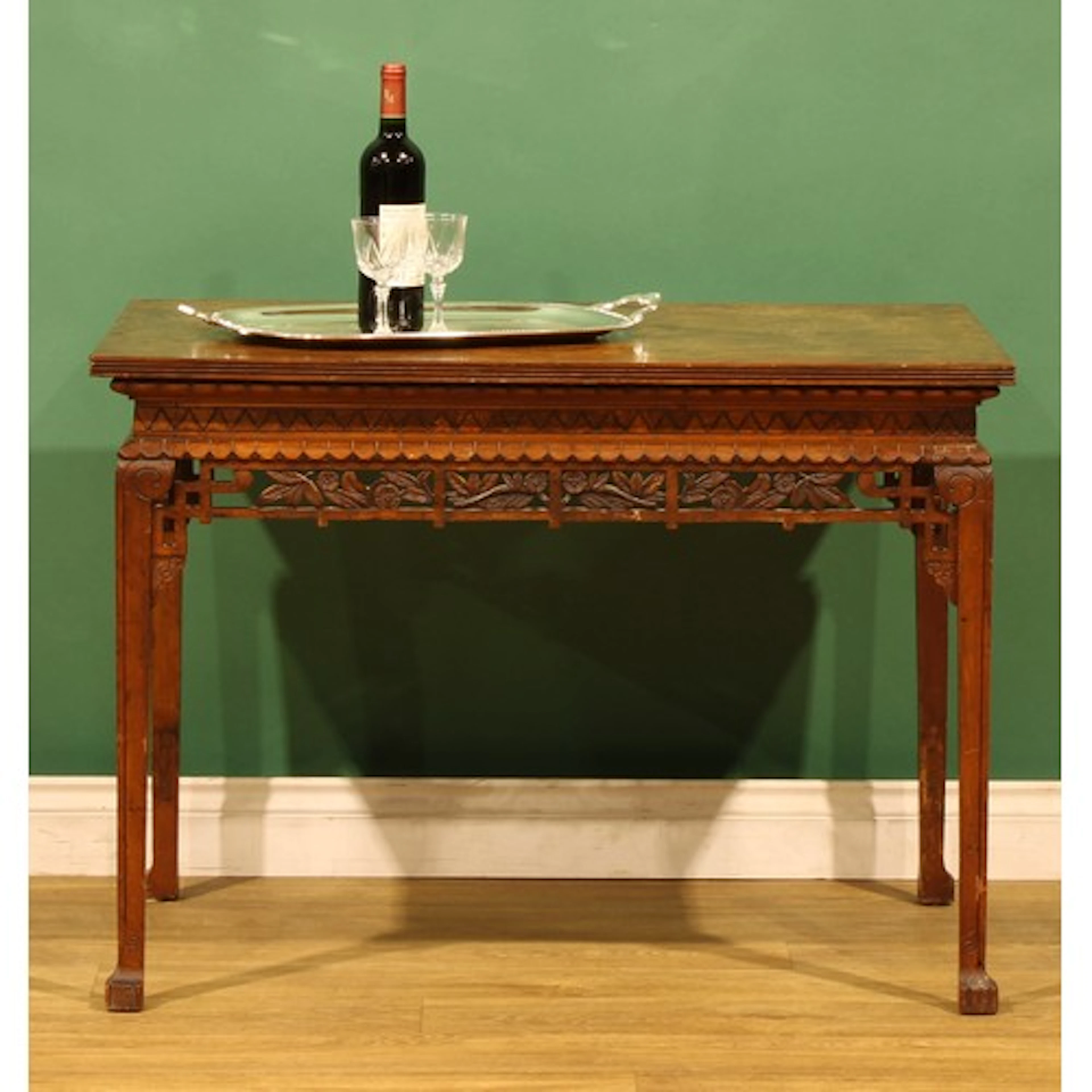 A Chinese Chippendale style walnut centre or silver table, q...