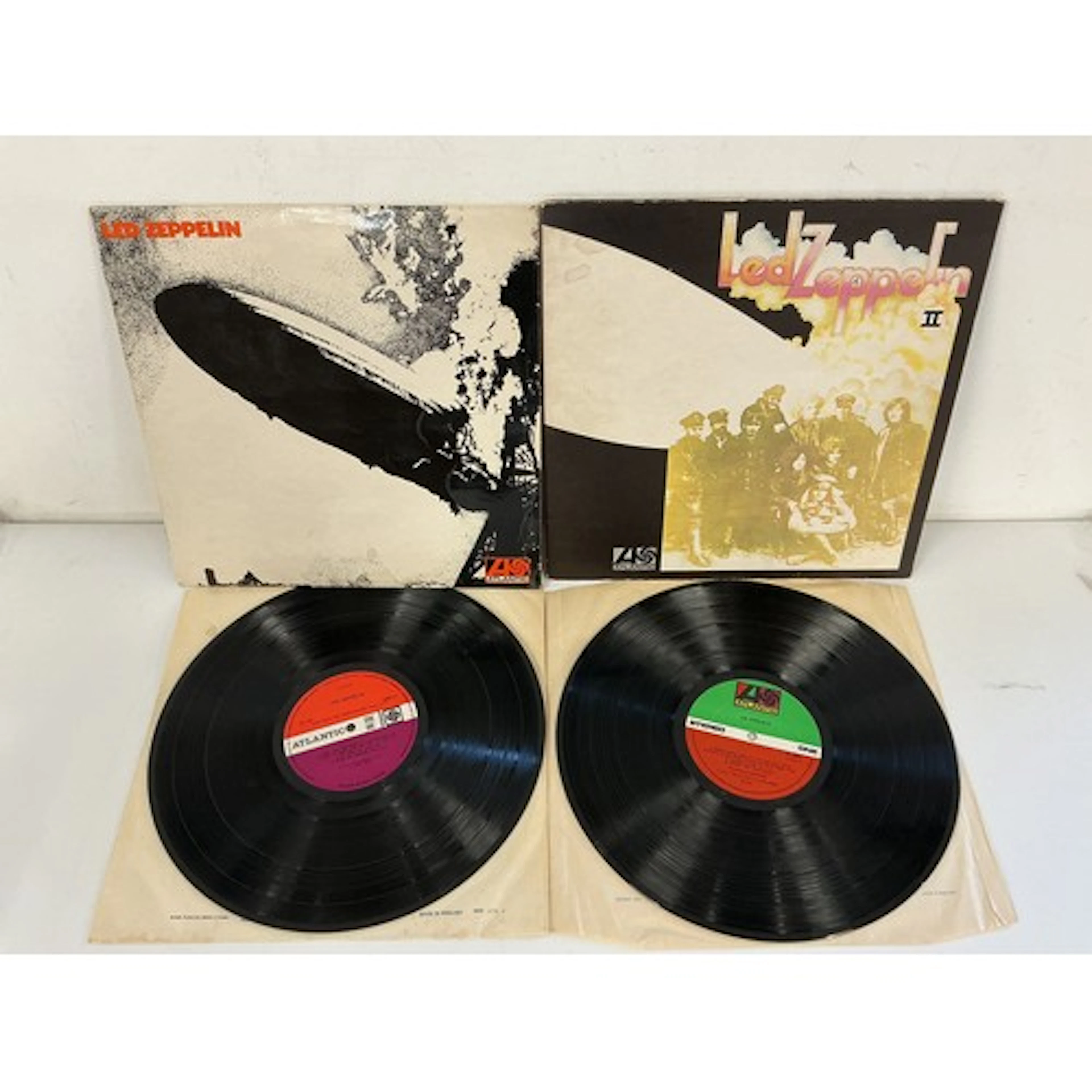 Two Led Zeppelin LPs comprising an early UK pressing of the ...