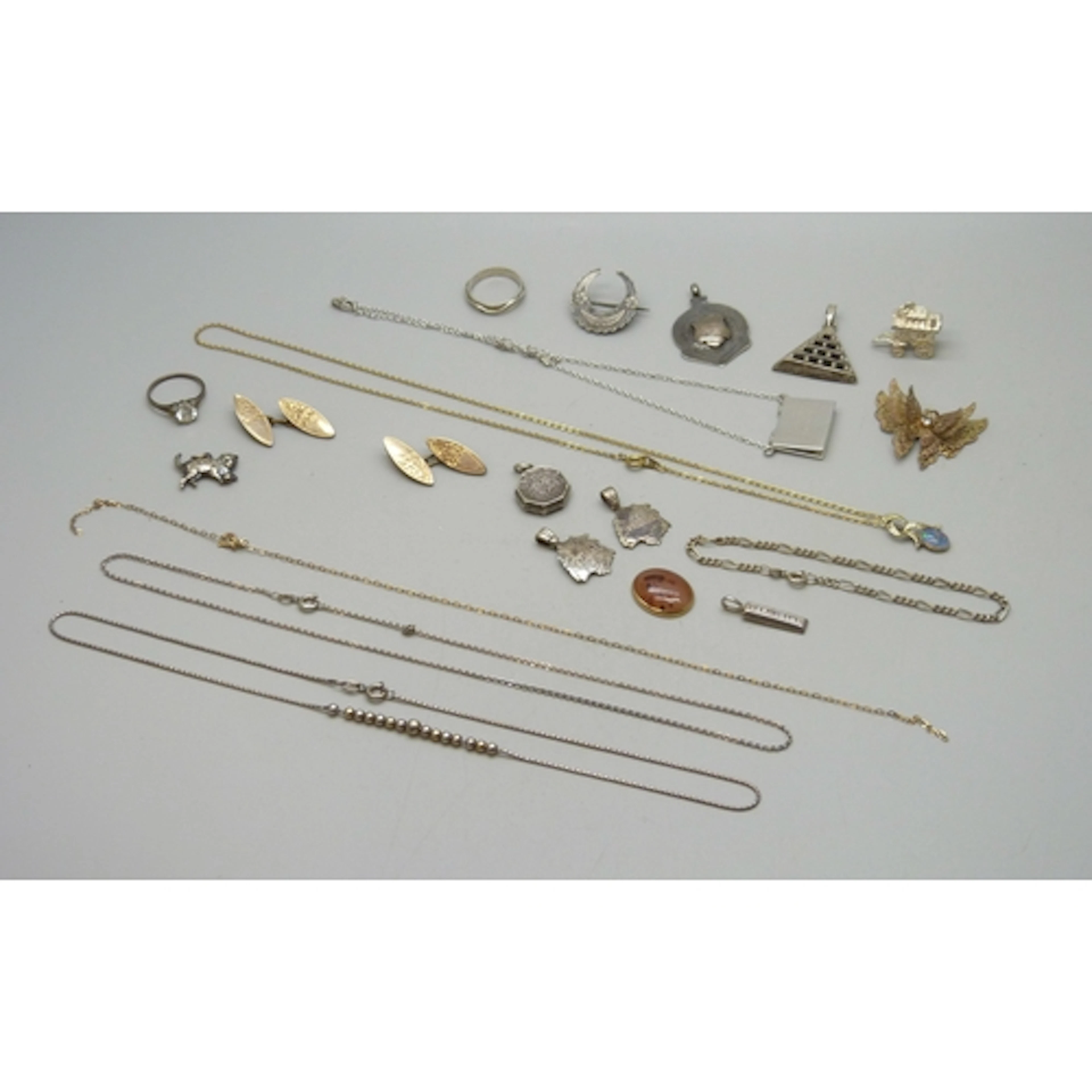 A collection of silver and white metal jewellery, some gilt ...