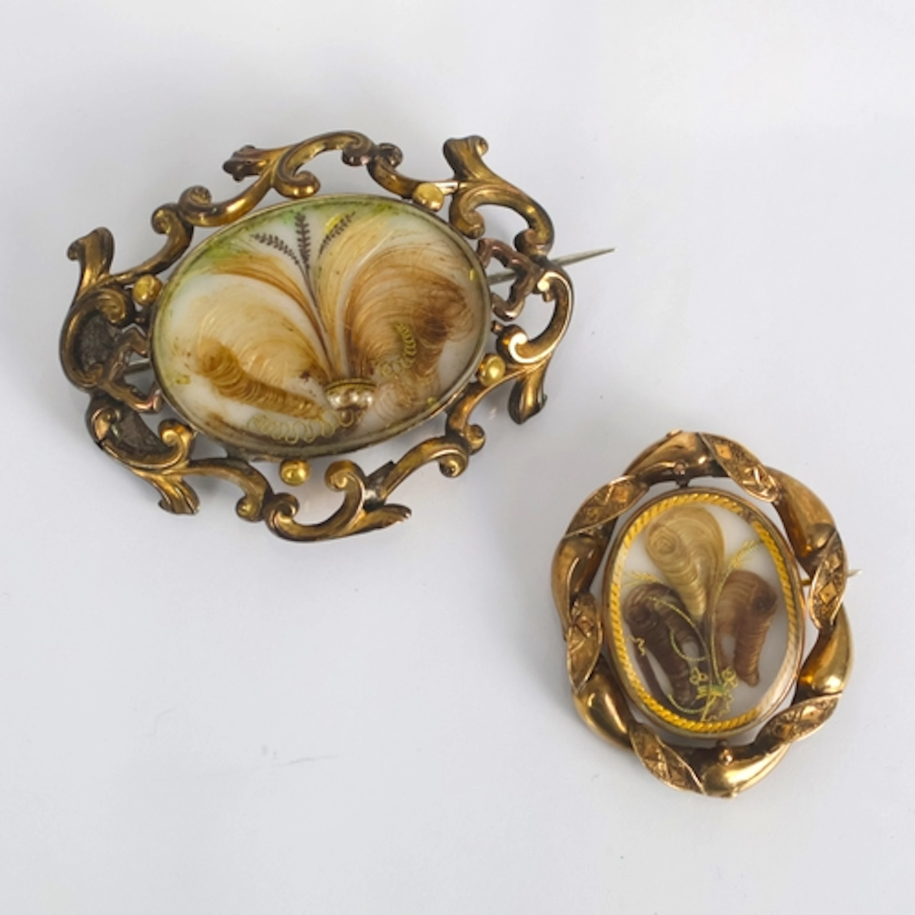 A 19th century mourning brooch, the articulated oval glazed ...