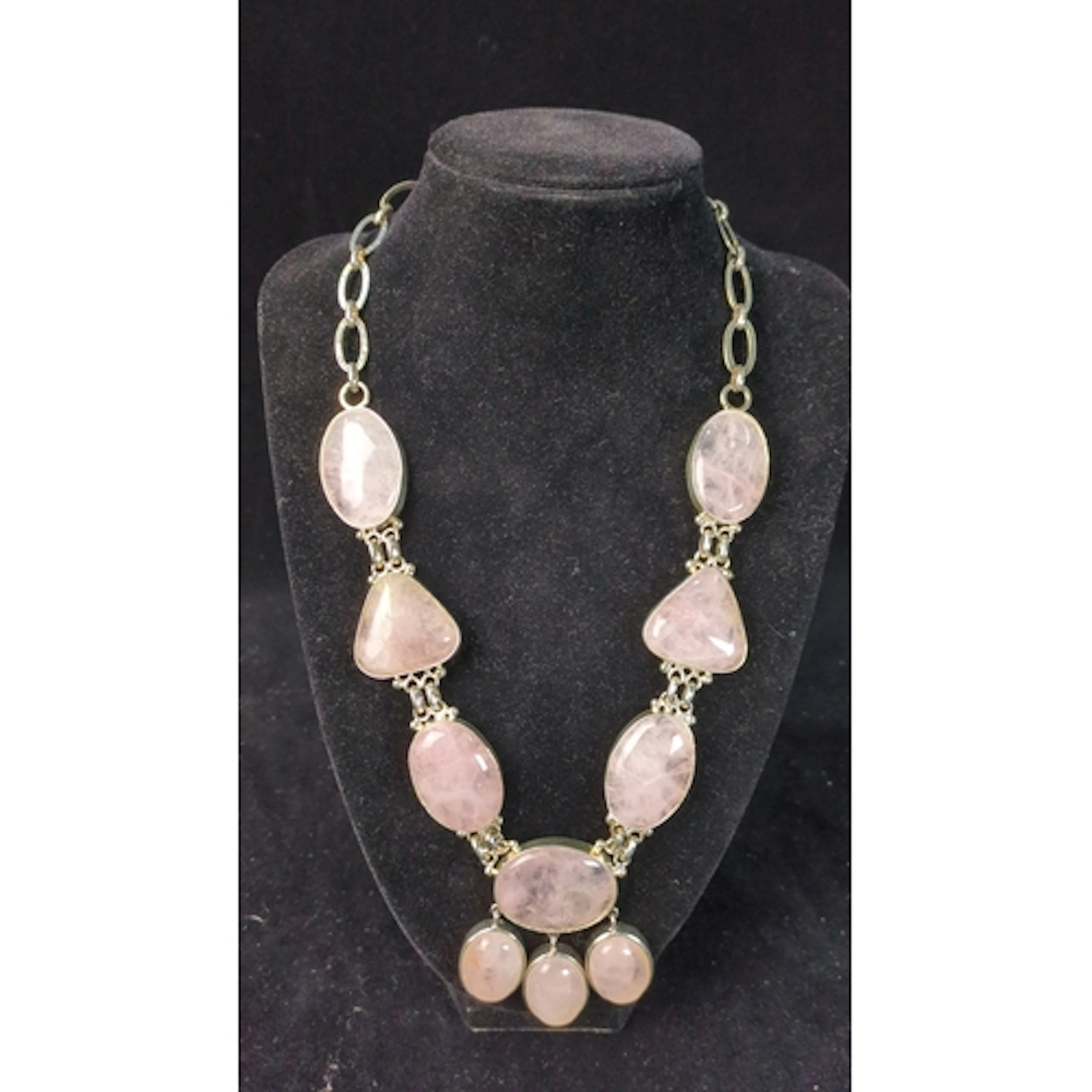 Sterling silver necklace set with rose quartz cabochons in o...
