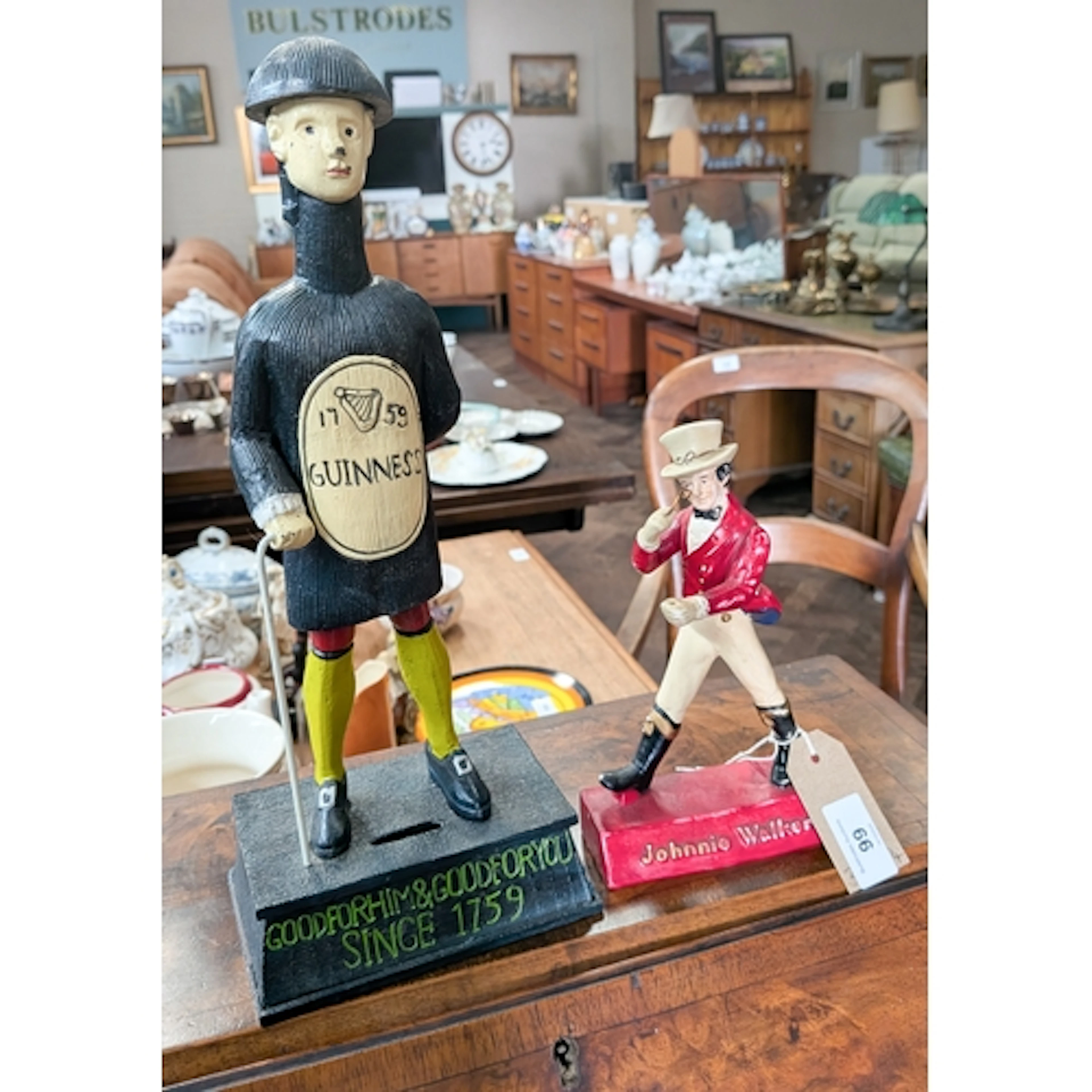 A painted metal Guinness figure advertising money box and a ...