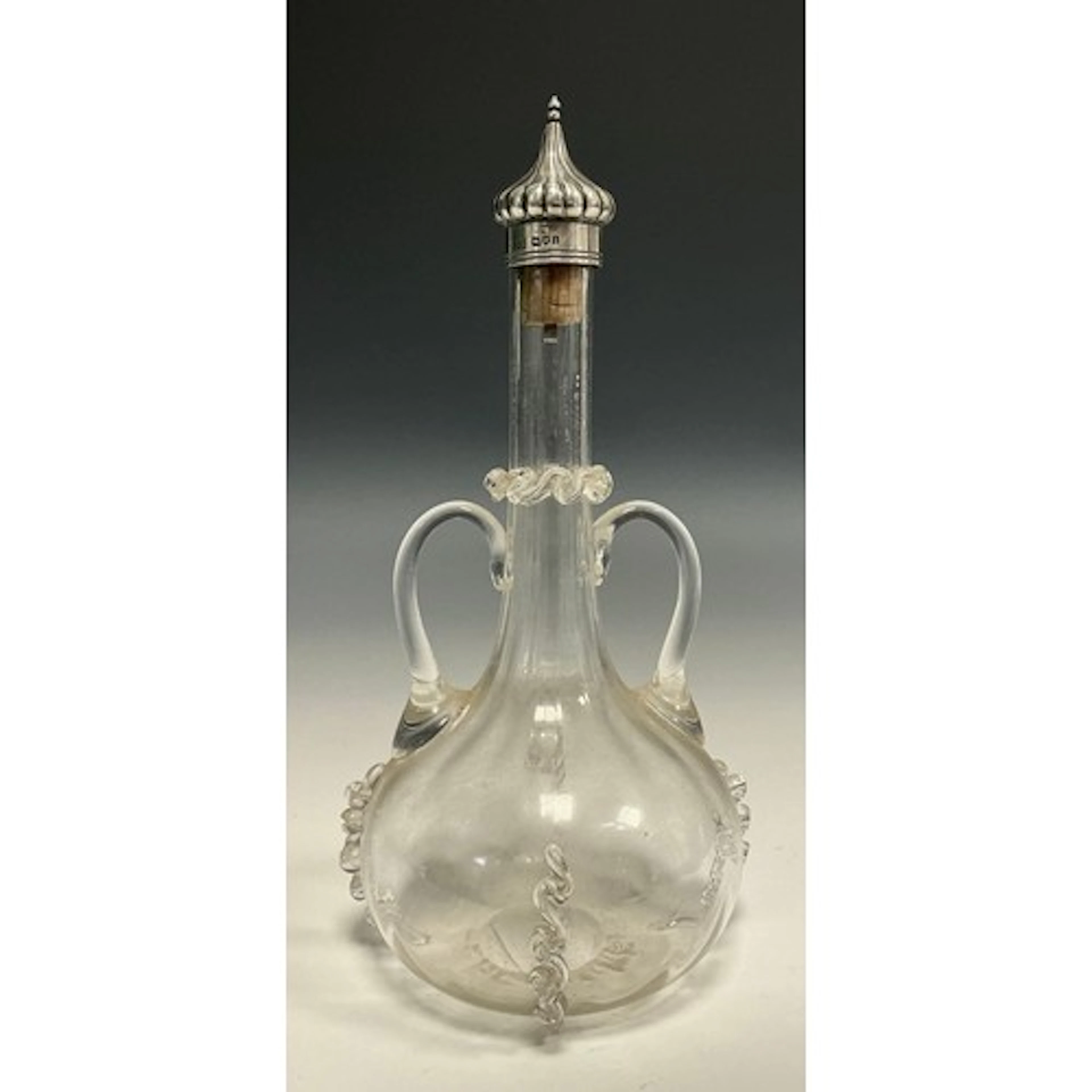 An Edwardian silver mounted decanter, in the Venetian taste,...