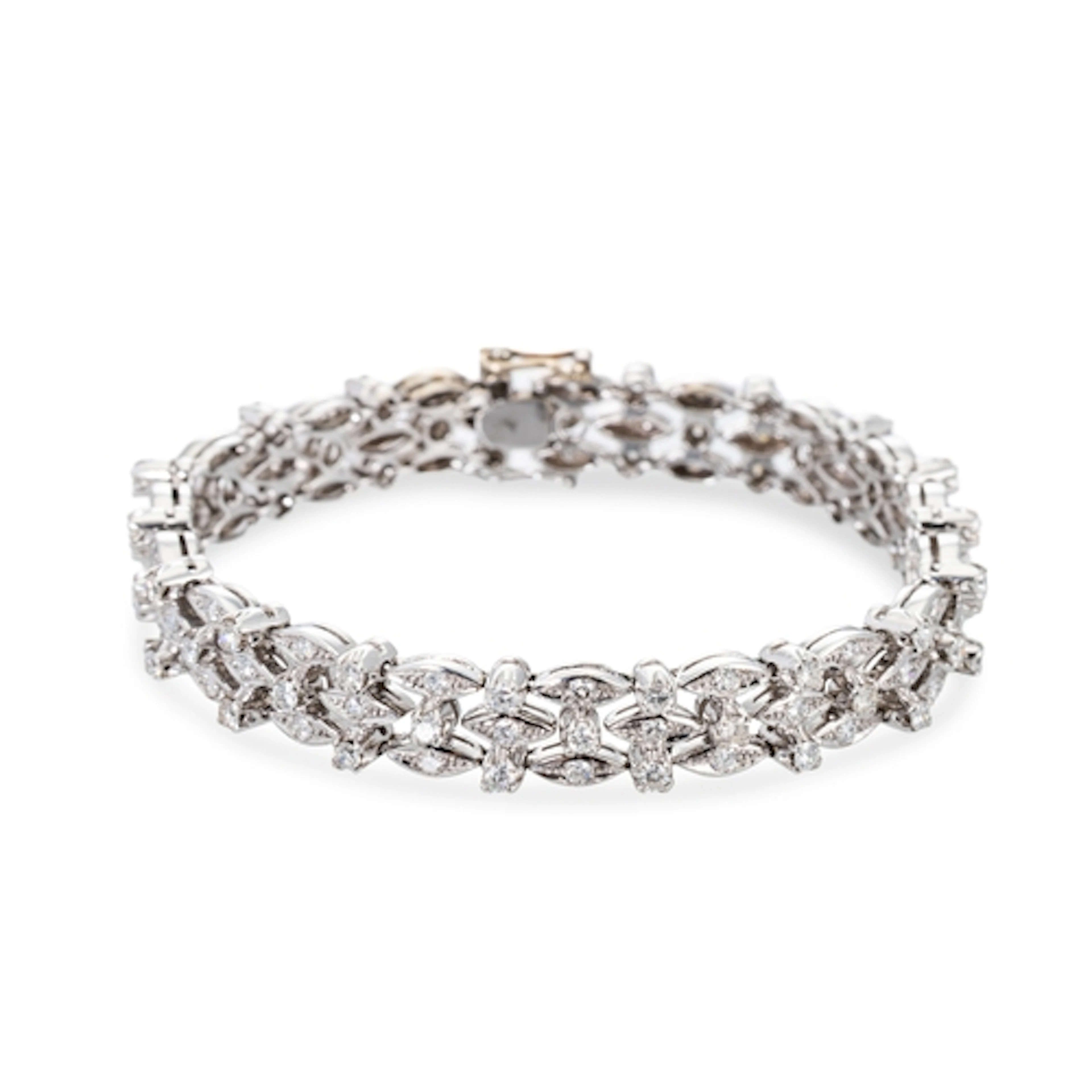 A DIAMOND OPENWORK CLUSTER BRACELET, mounted in 18ct white g...