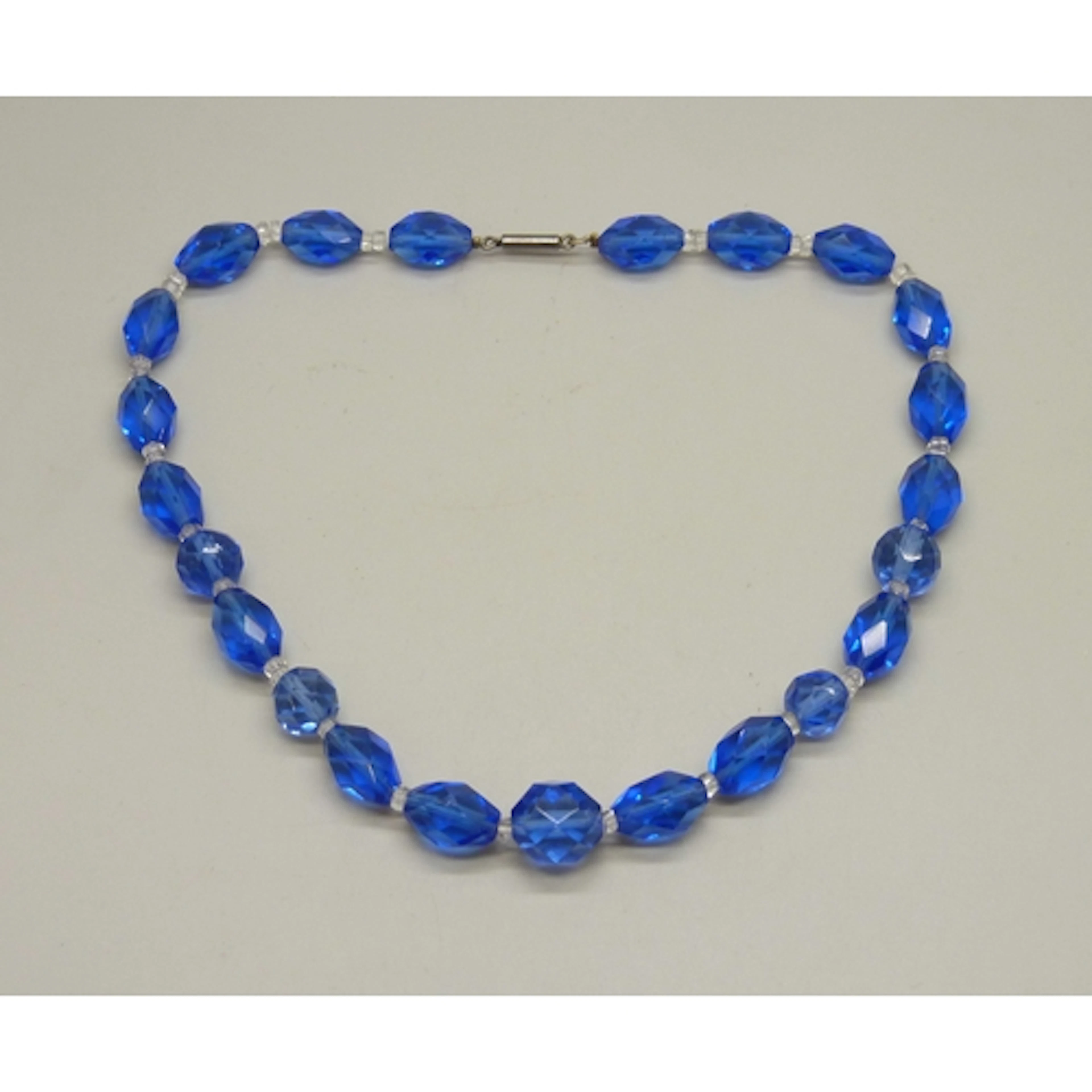 A circa 1930s Art Deco blue and white faceted glass stone ne...