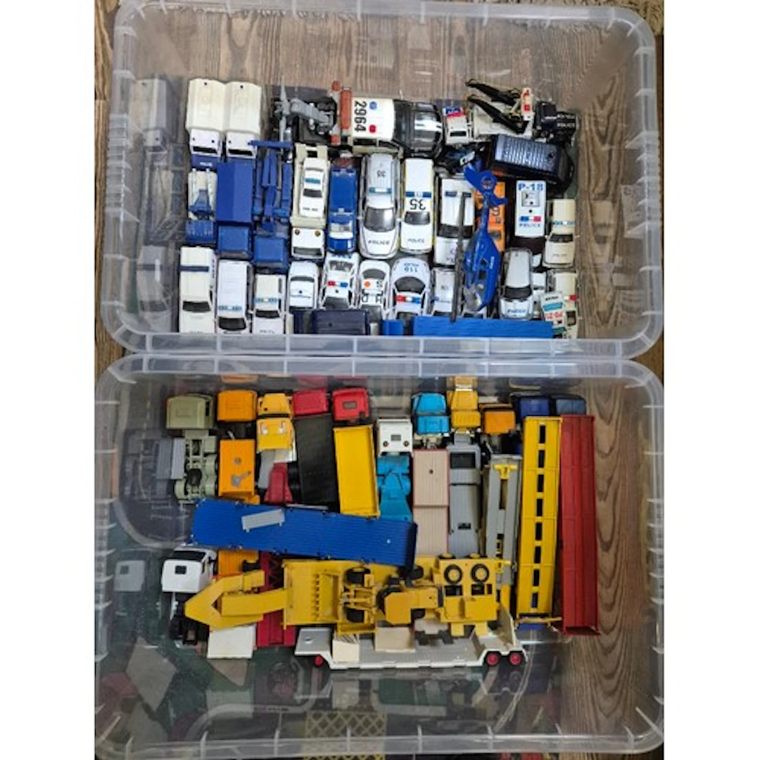Two boxes of assorted diecast model vehicles to include Corg...