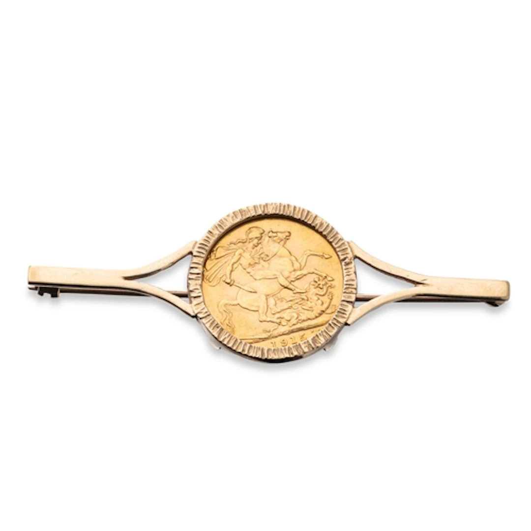 A 1915 FULL GOLD SOVEREIGN ENGLISH COIN, in a loose bar broo...
