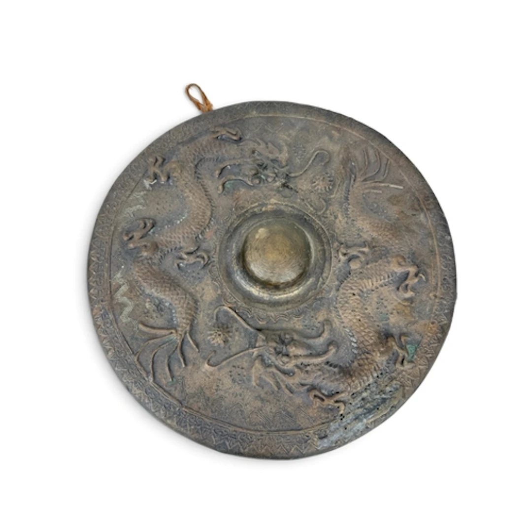A CHINESE BRASS GONG DECORATED WITH TWO DRAGONS 34cm W...