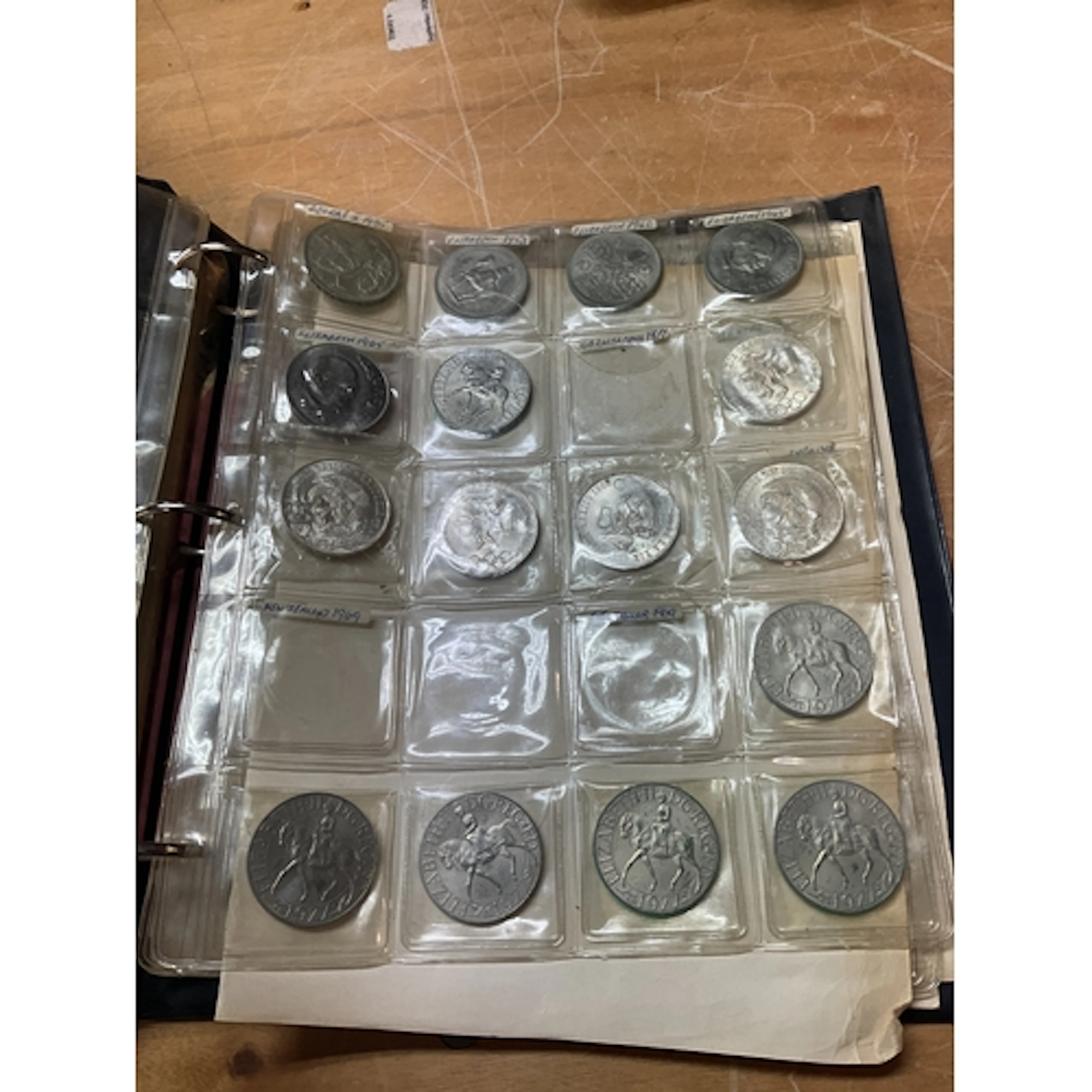 Coin album with rocking horse crown, foreign silver crowns a...