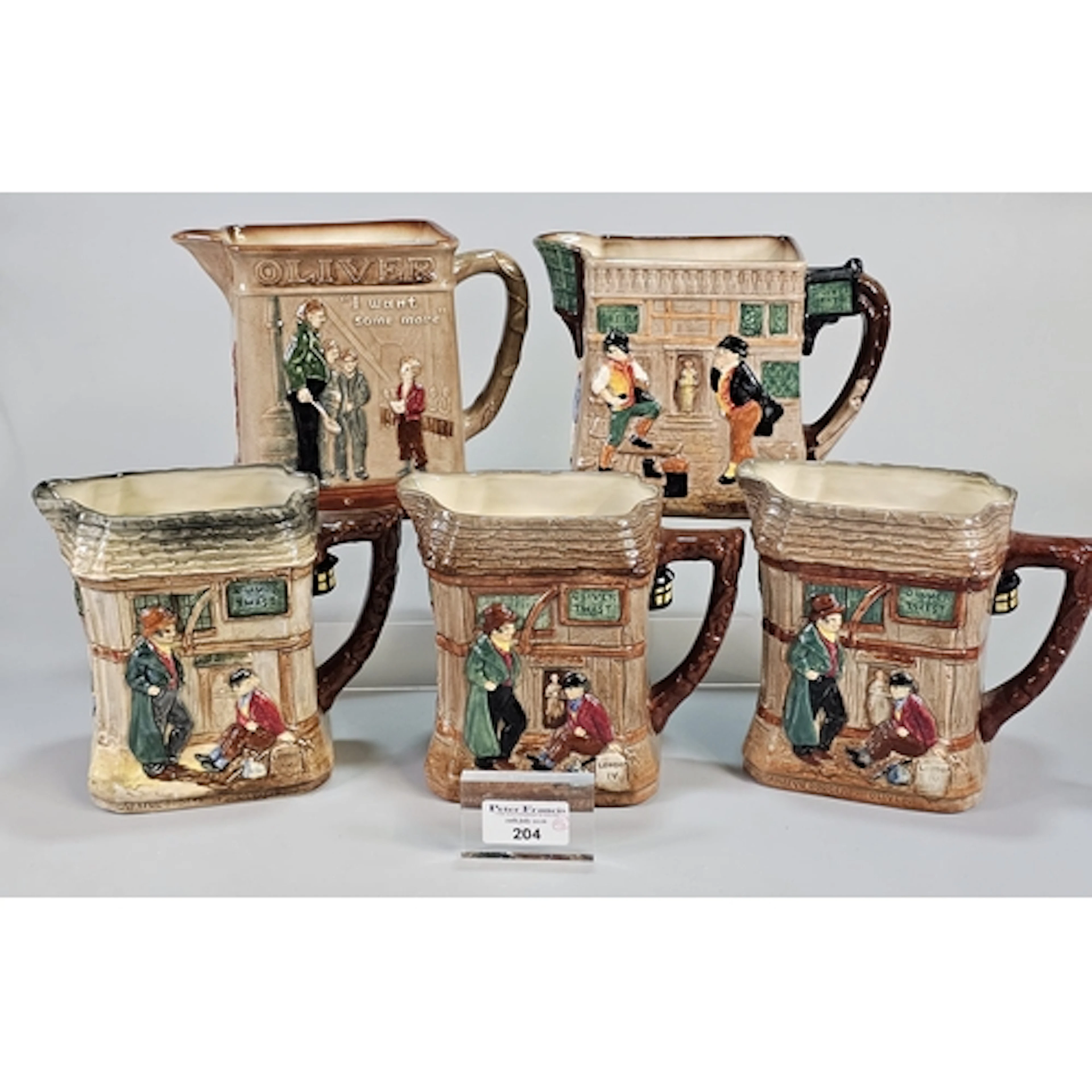 Five Royal Doulton 'Pickwick Papers' and 'Oliver Twist' jugs...