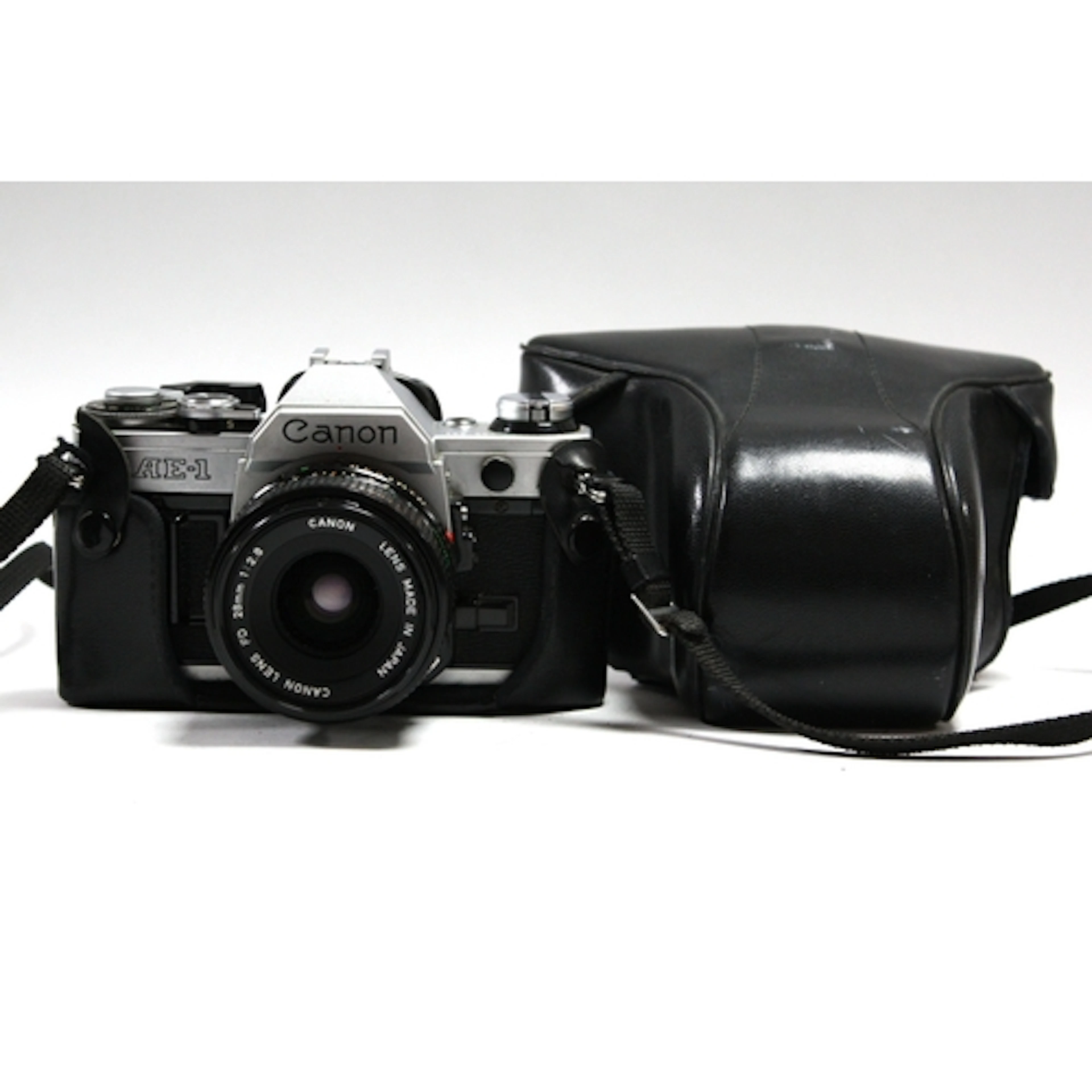 Canon AE-1 35mm SLR Film Camera with attached Canon FD 28mm ...