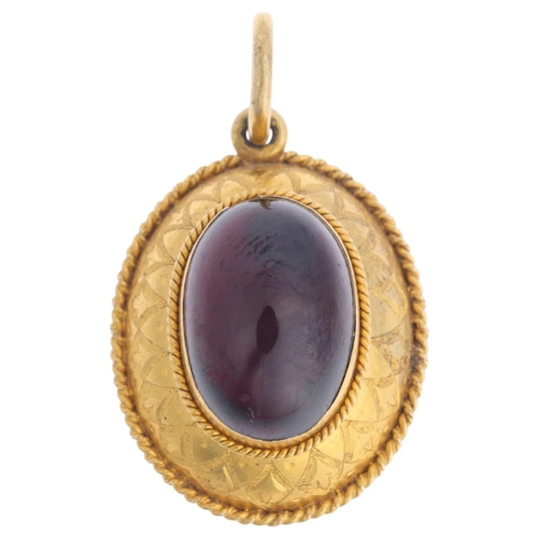 An Antique Victorian Etruscan Revival gold garnet mourning l...