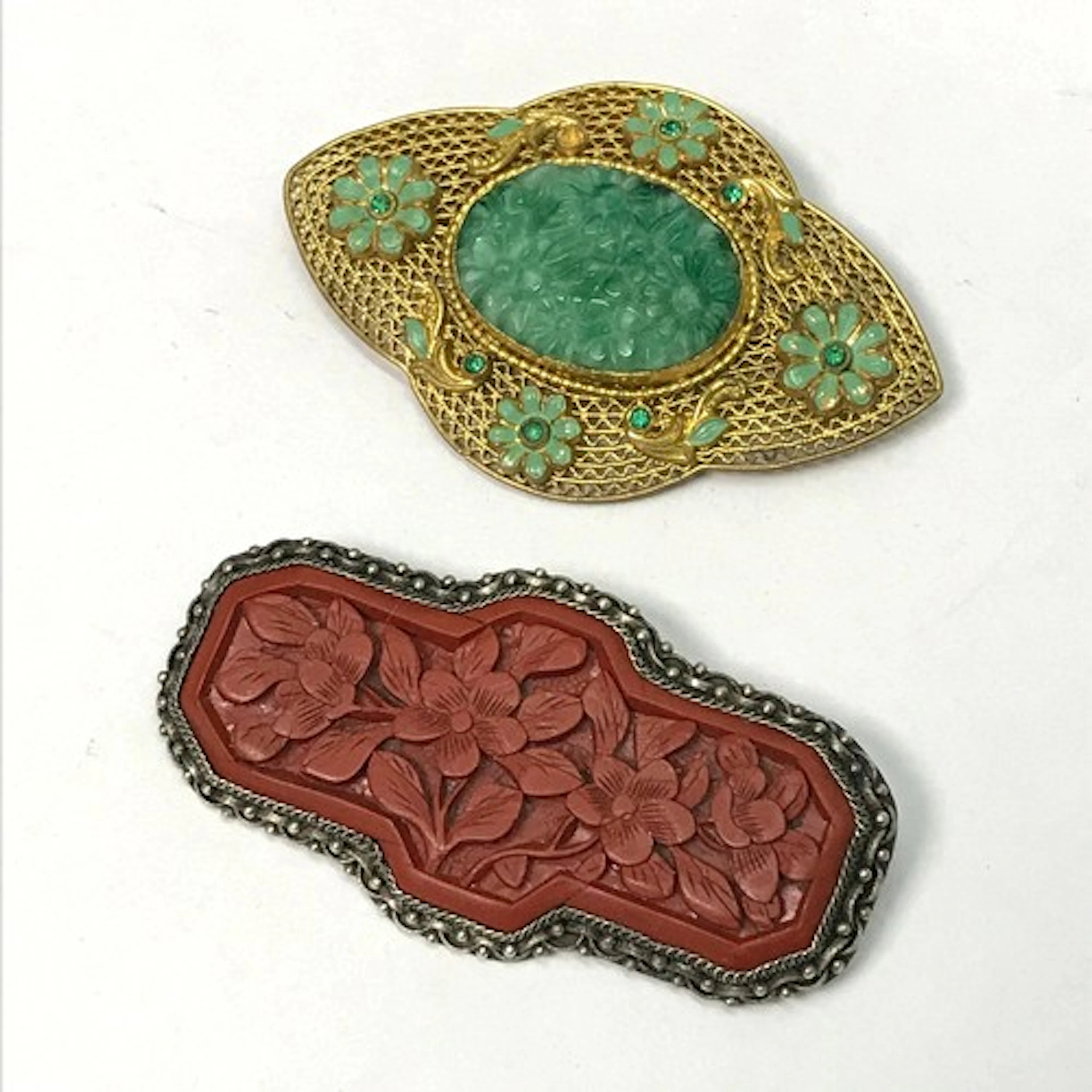 A Chinese white metal and cinnabar enamel panel brooch indis...