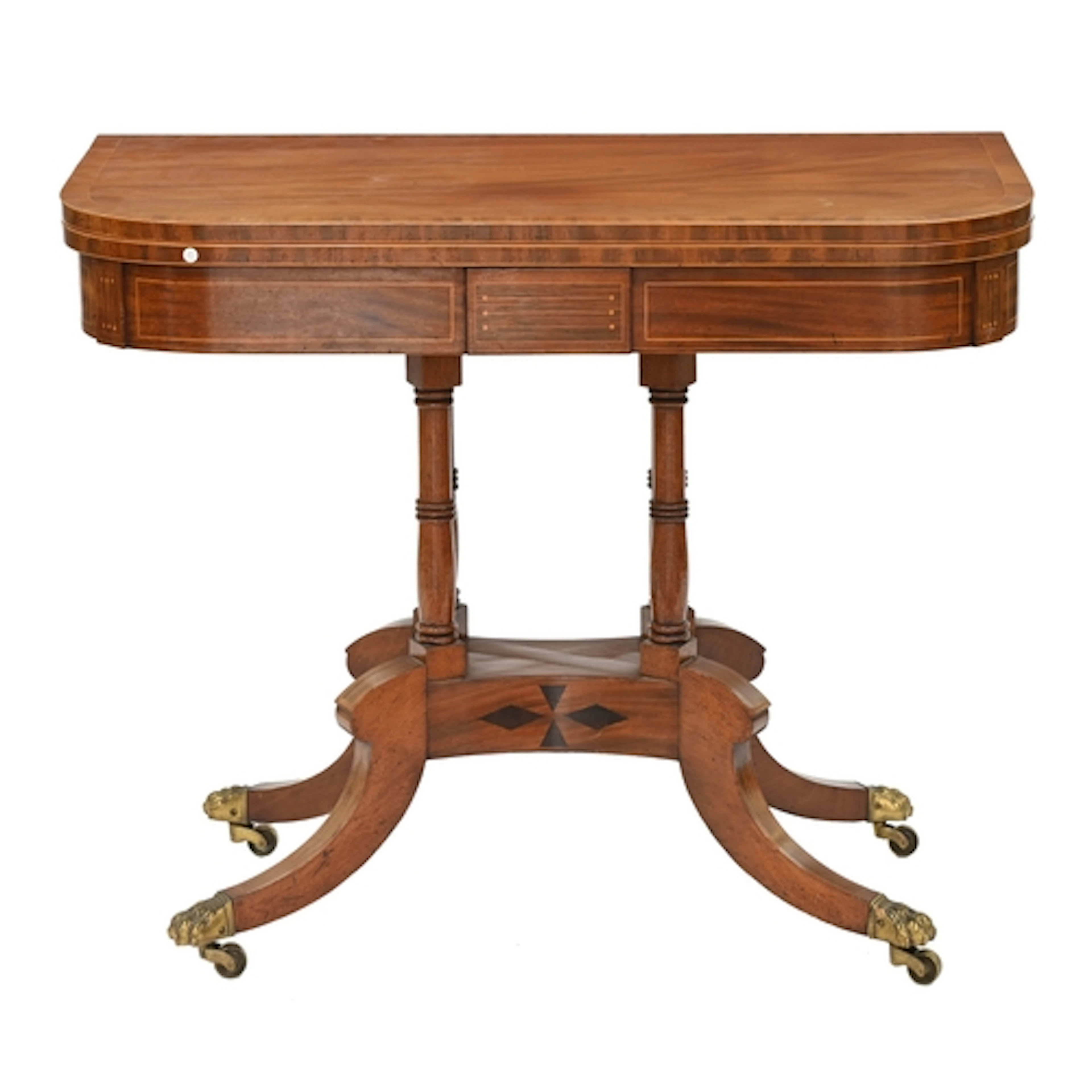 A Regency mahogany and inlaid tea table, on quadruple ringed...