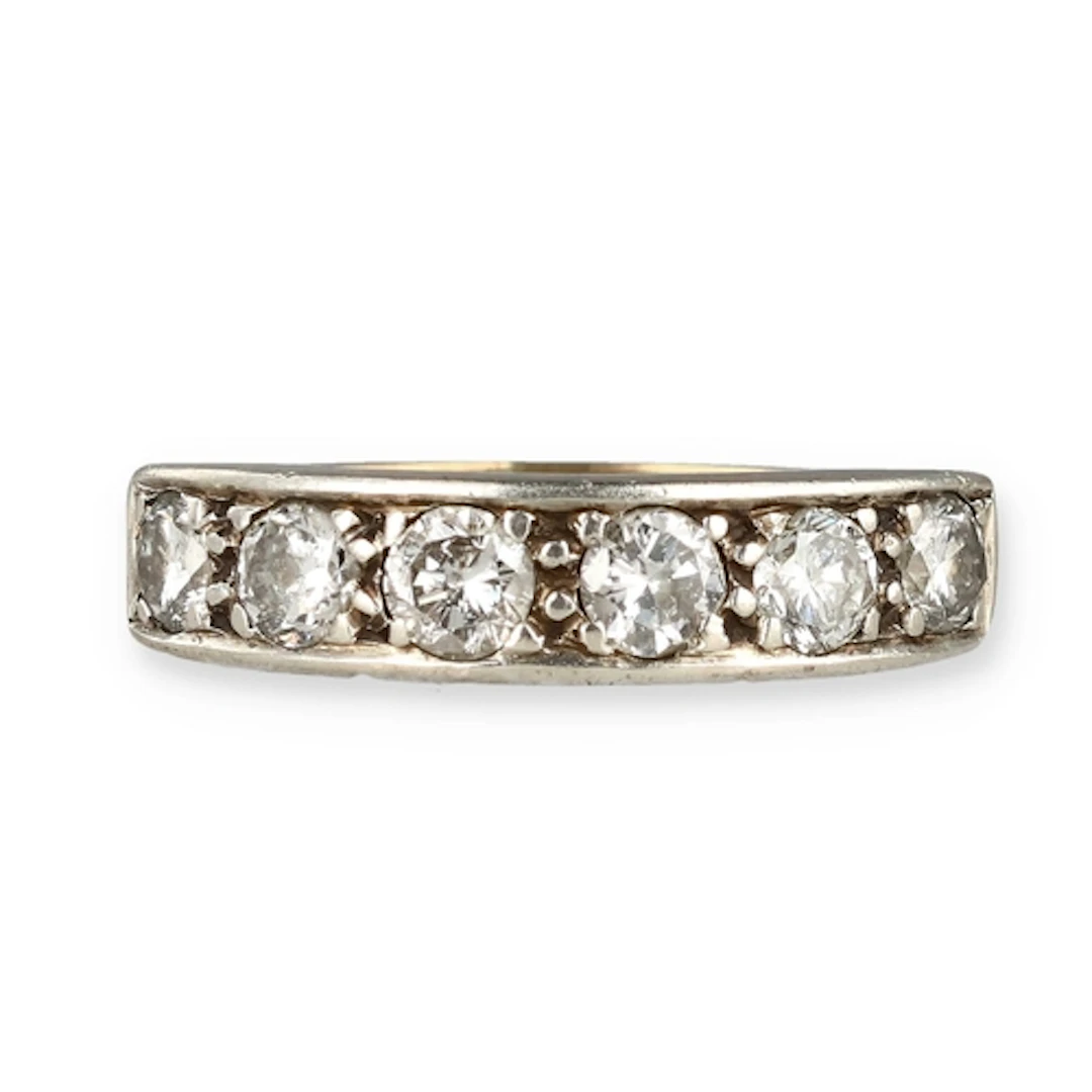 A GOLD SIX STONE RING Stones test as moissanite Weight: 3.1g...