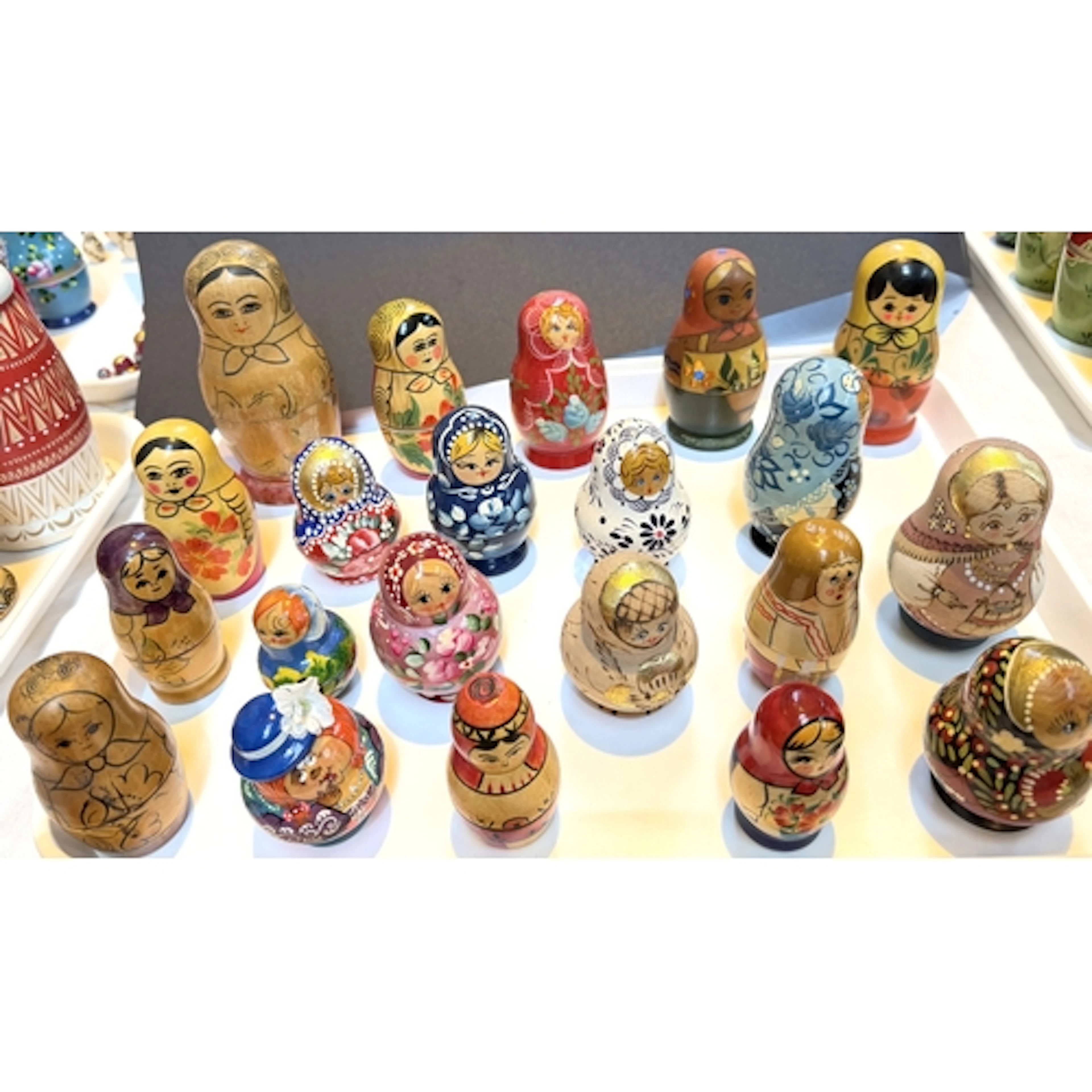 A collection of Russian Matryoshka wooden nests of girl doll...