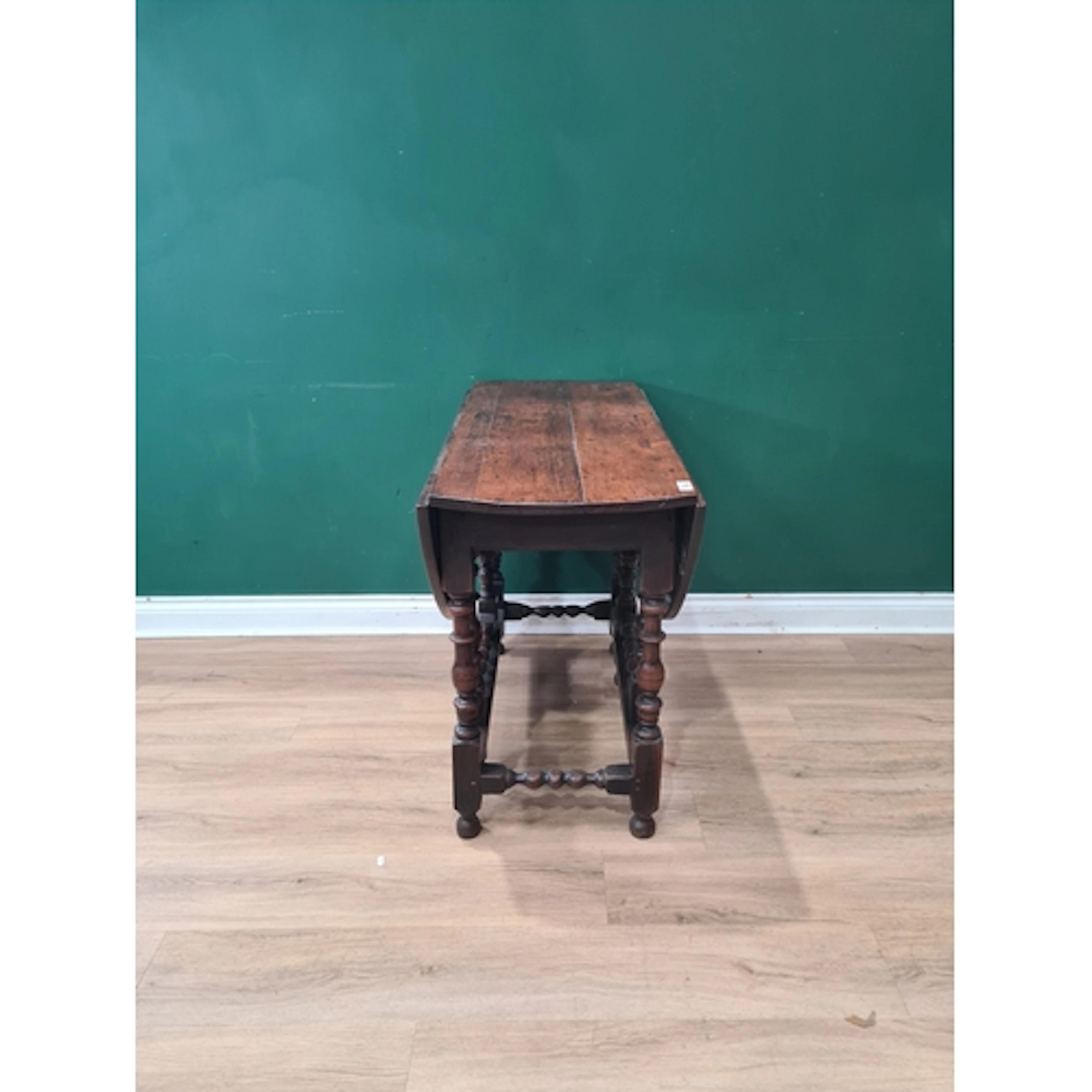 A 17th Century oak Gateleg Table raised on bobbin turned sup...