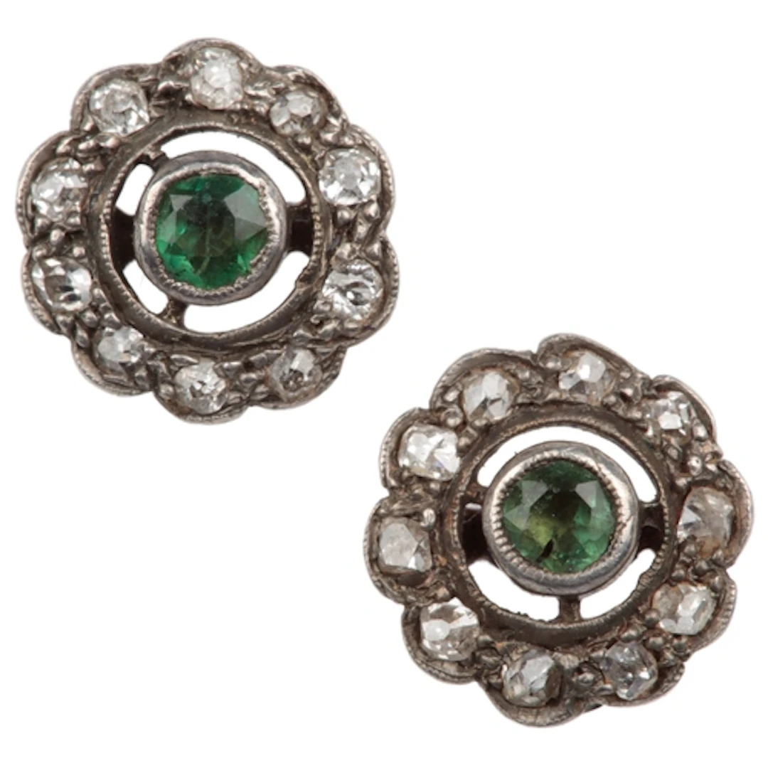 A pair of emerald and diamond stud earrings, each collet-set...