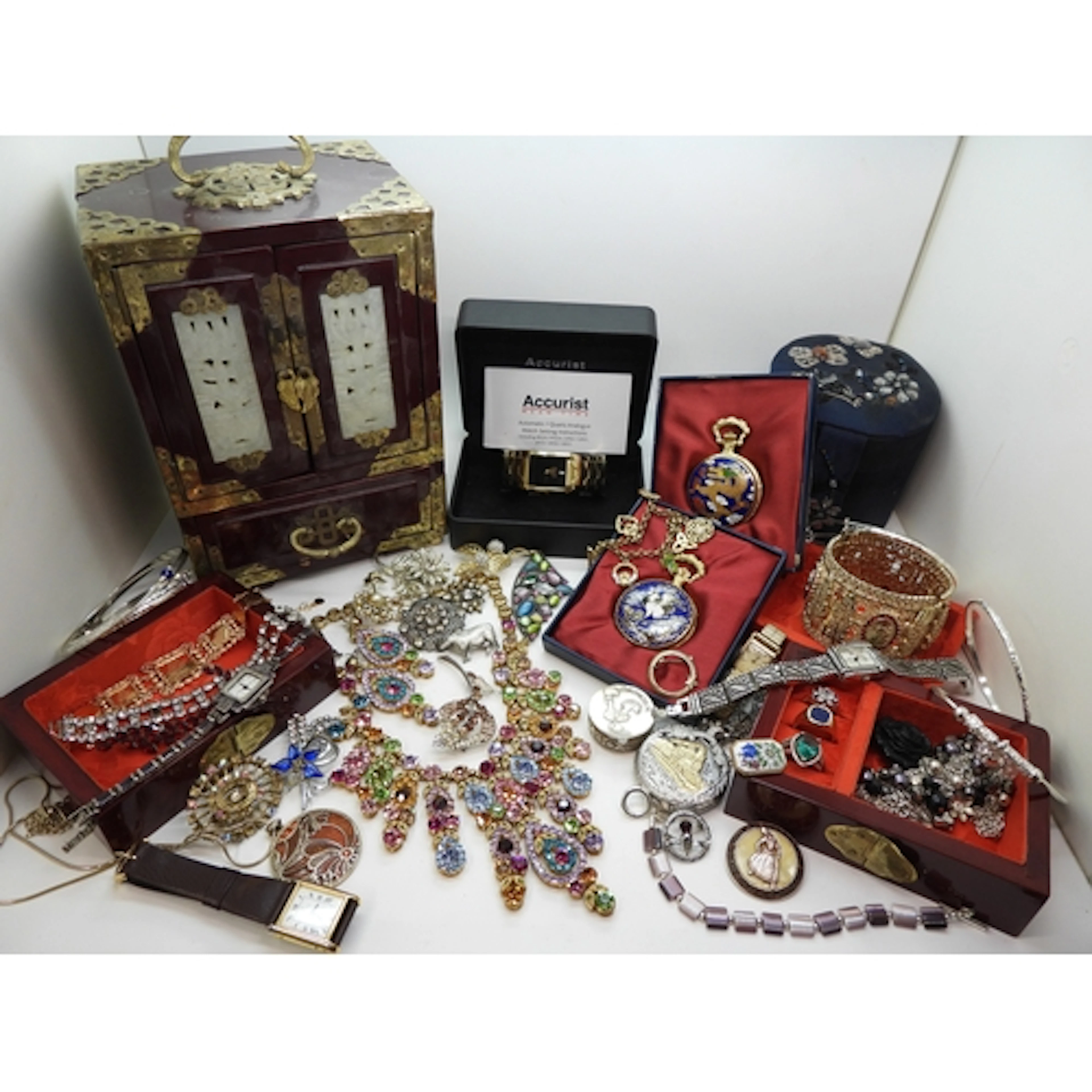 An Oriental jewellery box with a collection of costume jewel...