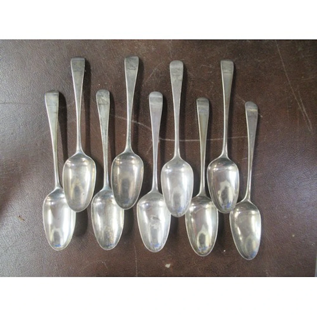 9 mid 18th century silver serving spoons, all engraved with ...
