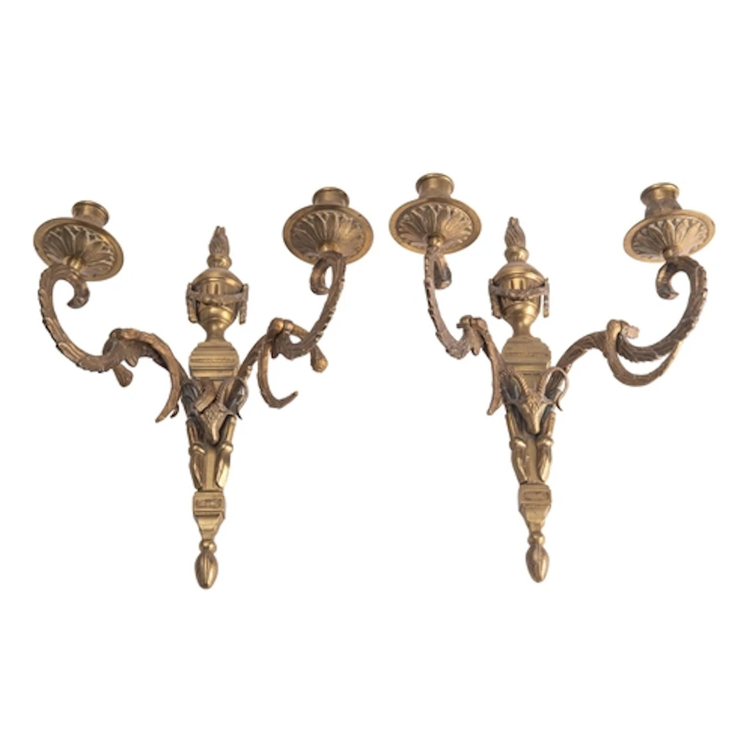 A pair of gilt metal twin light wall appliques in Louis XVI ...