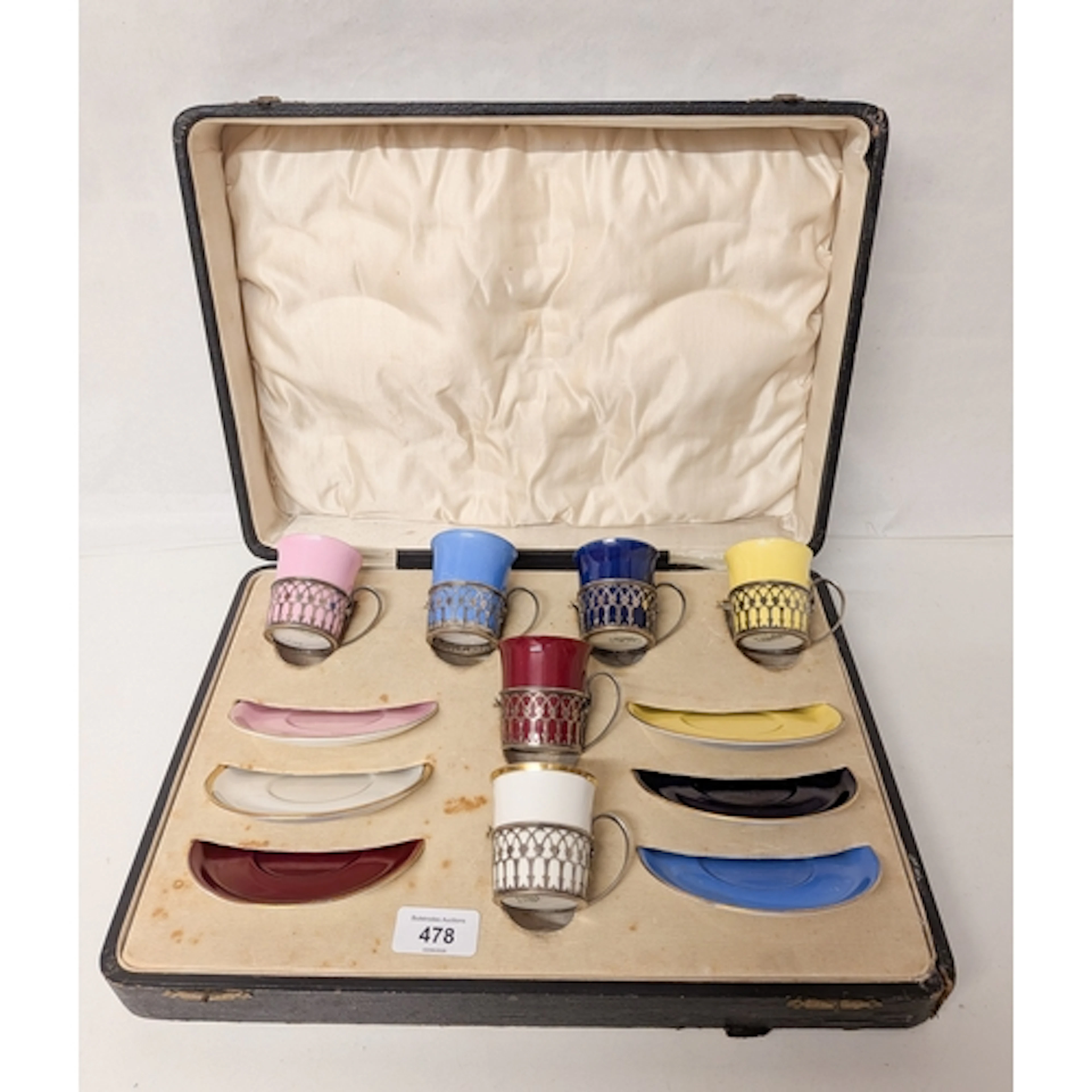 A Shelley coffee service, with silver cup holders, in a fitt...