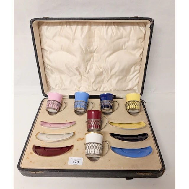 A Shelley coffee service, with silver cup holders, in a fitt...