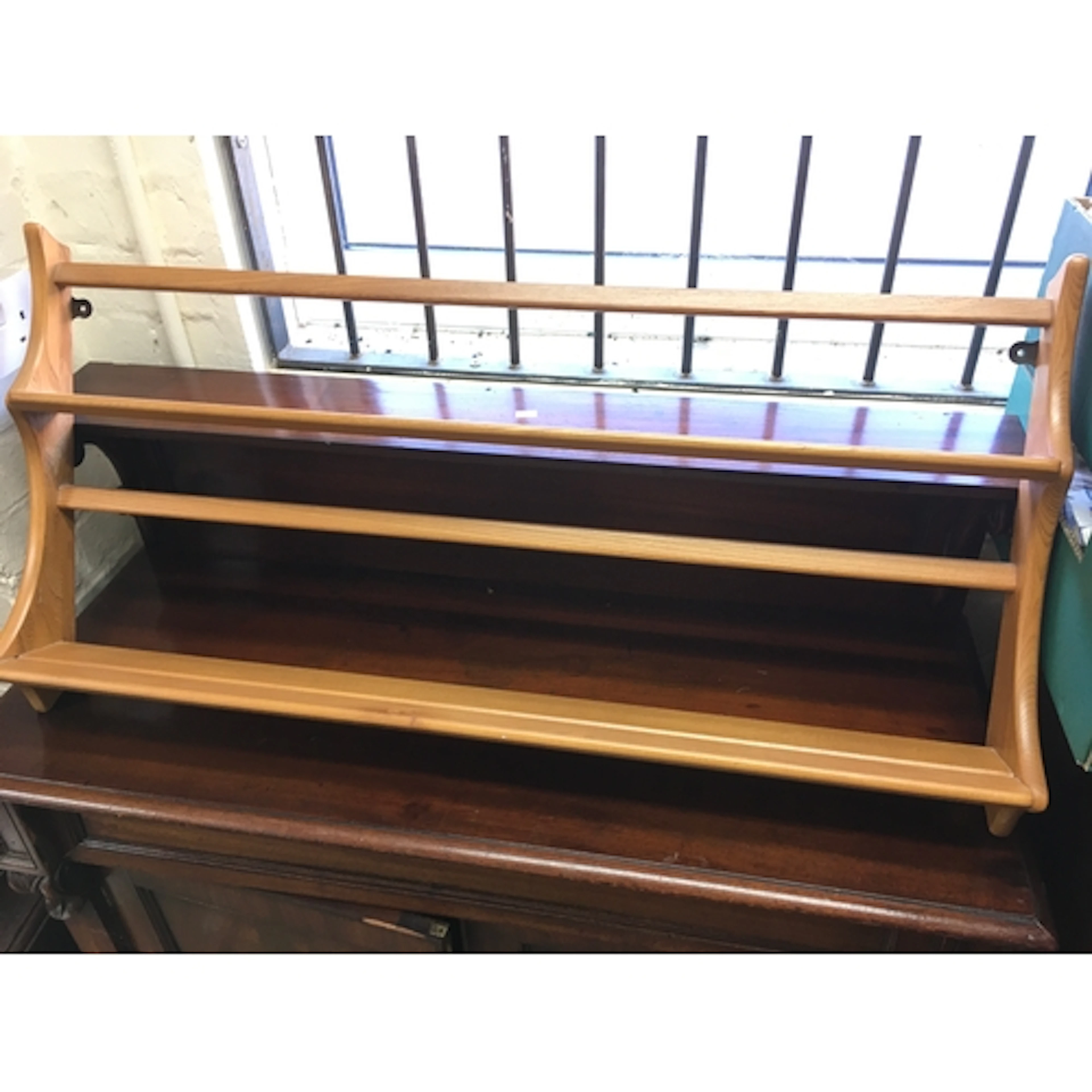 An Ercol plate rack. 38 inches wide.