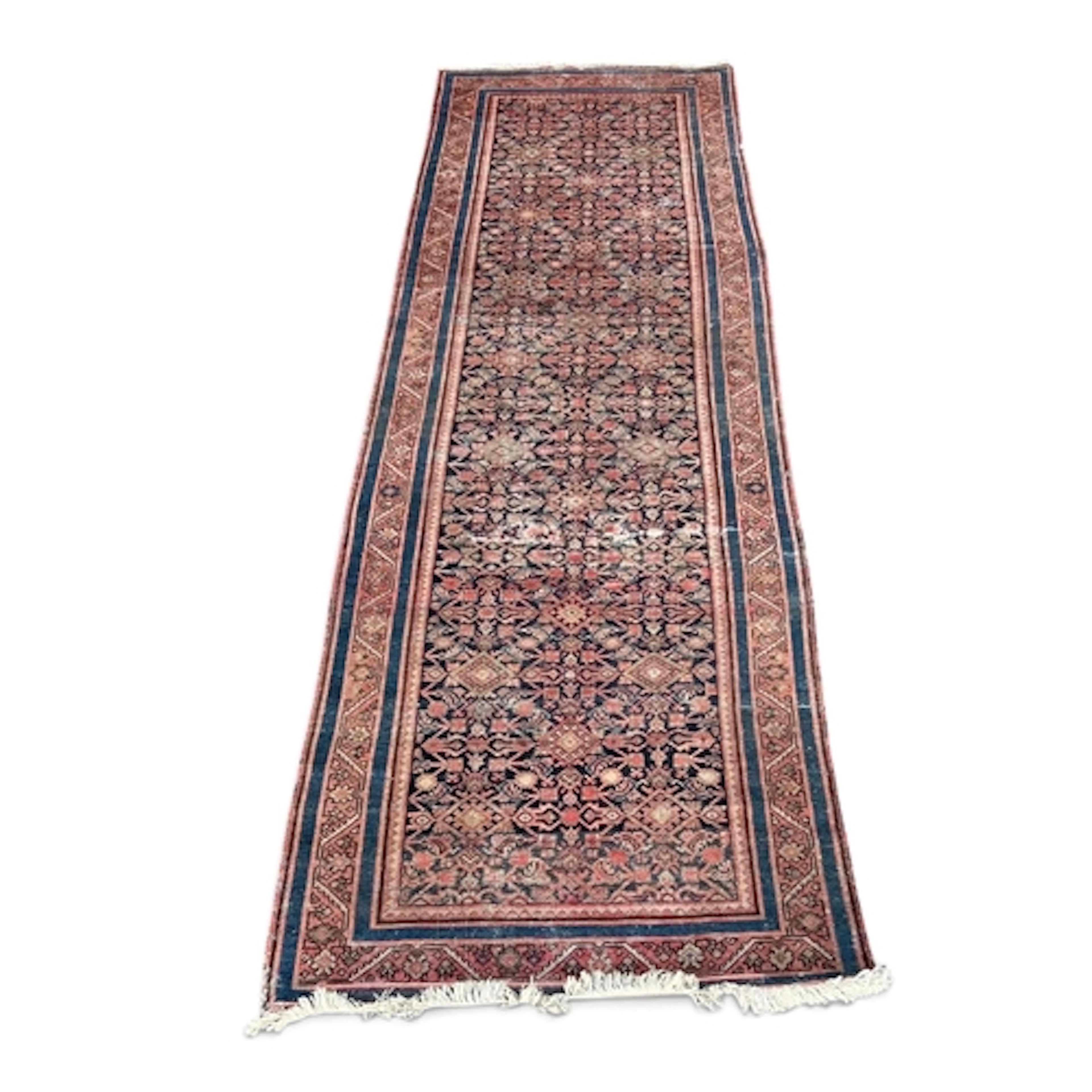 A PERSIAN RUNNER 294cm x 95cm