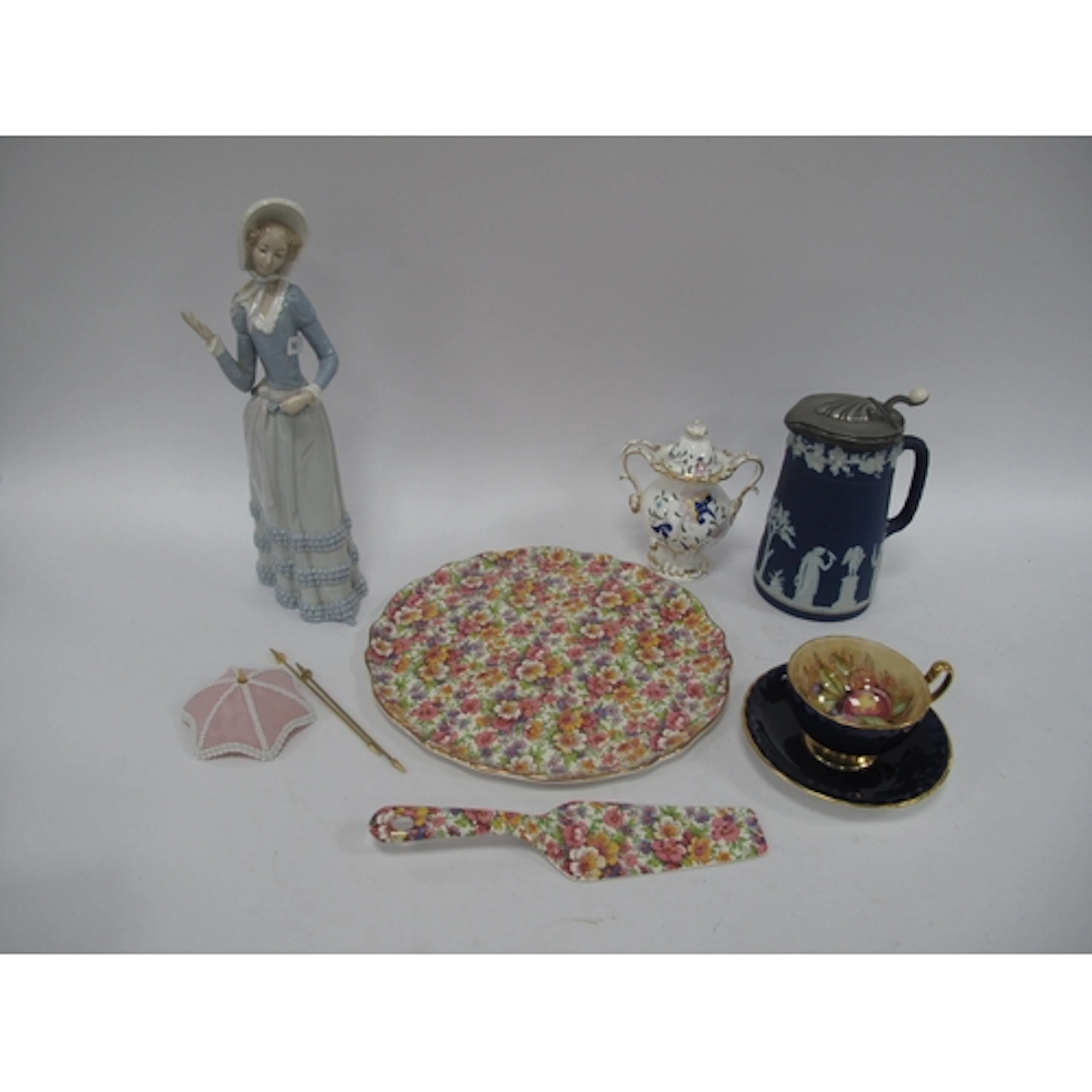 Lladro Lady, 31cm high, together with original boxed umbrell...