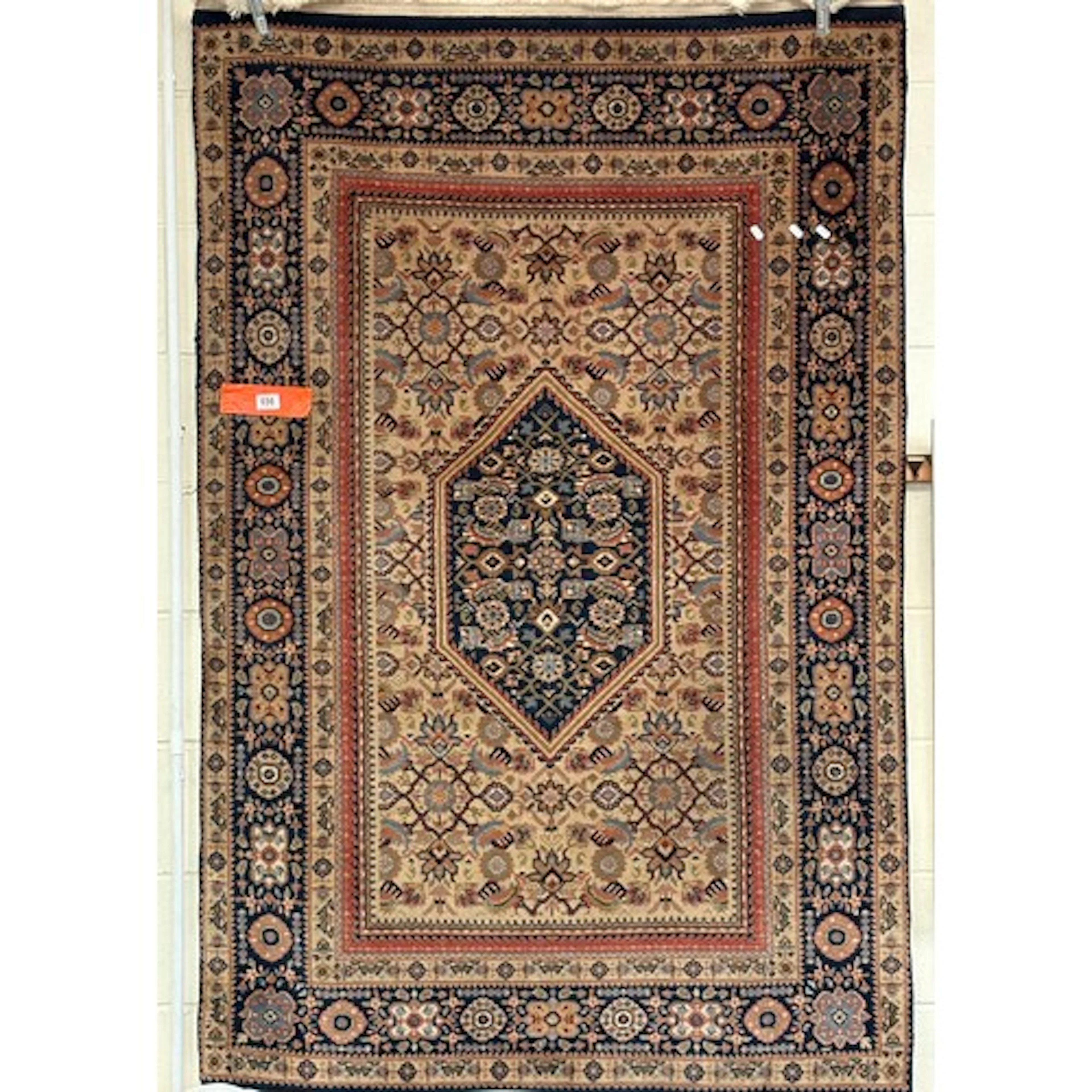 A Persian-style oriental rug